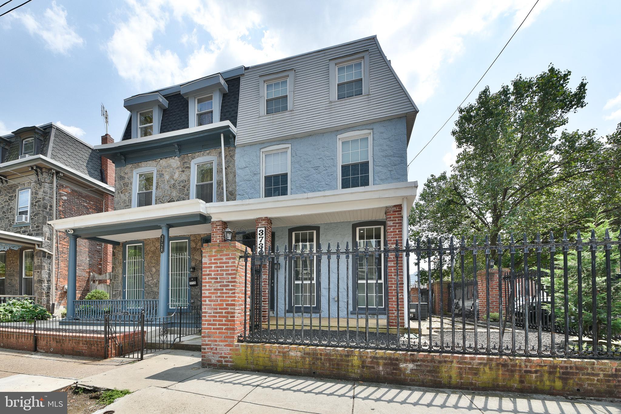Newly Remodeled Corner Twin in Historical Powelton Village. Enter location through a Wrought Iron Gate and front entrance to a recently remodeled home with a Fantastic Open Floor plan. Hardwood floors throughout with abundant space including a Living Room and Dining Area Plus an Ultra Modern Kitchen featuring plenty of white cabinetry highlighted by stainless steel appliance group and amazing gray quartz counter top with convenient island. The layout is great for cooking and entertaining. Also available a two piece powder room. Upstairs features two large bedrooms both with fully upgraded ceramic baths. The front bedroom featuring a large jetted hot tub and plenty of closet space in both. The third floor features another Bedroom with a large full bath and plenty of natural light. Plus a sky line exterior deck also great for entertaining and getting some sun and fresh air. This home is move in ready nice primary residence but it was also set up to allow an investor to house local university students. Plus features a large finished basement with laundry. Which could be used as a potential fourth bedroom. Home features two HVAC Systems for its over 2000 square feet of living space. Exterior is surrounded by Wrougth Iron and Brick. Creating privacy for a nice front porch, side yard and patio with side entrance to the kitchen. Home conveniently located to Drexel and Penn Universities and SEPTA Bus Route. Available immediately.