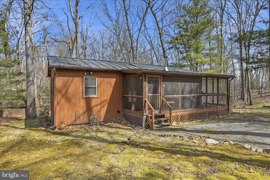 Meticulously maintained 3-bedroom, 1-bath cabin tucked away in the heart of the highly sought-after Lost River Valley. This charming retreat blends rustic appeal with comfortable living, featuring a warm and inviting interior, well-appointed bedrooms, and a serene setting surrounded by natural beauty and mountain views. Thoughtfully cared for and move-in ready, the property offers exceptional versatility as a private getaway, full-time residence, or turn-key short-term rental investment. Enjoy peace, privacy, and the relaxing lifestyle this special cabin has to offer.