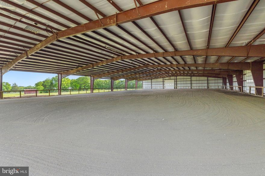 Welcome to your dream equestrian property nestled on 24 acres of picturesque land, offering unparalleled amenities for both horse enthusiasts and those seeking a tranquil countryside retreat. Zoned A-1 in the heart of Prince William County.

As you enter the property, you'll be greeted by a quality crafted 15-stall barn, featuring an asphalt floor and custom-designed dirt stone stalls  with removal partitions to expand stall size, if desired. Each stall boasts 36" x 36" Anderson glass windows that open, providing ample natural light and ventilation for your beloved equine companions. A dedicated 12' x 24' foaling stall equipped with heat lamps ensures the safety and comfort of newborns.

The barn, with a new roof installed in 2018 and updated gutters in 2019, also includes essential facilities such as a washing area with hot/cold water available, dedicated office space, and a tack room for all your equestrian gear storage needs.

In addition to the barn, discover the impressive 115' x 200' covered riding arena, constructed in 2017 and never used, offering endless possibilities for riding, instruction, competitions, and more. Featuring 14' x 14' commercial doors, buried downspouts, and commercial-grade insulation, this arena is designed to accommodate various riding disciplines and can also cater to other types of livestock activities.

Additional amenities include a 20' x 30' storage barn with a concrete floor, metal roof, and electricity, perfect for equipment storage or potential expansion. The property also boasts several outbuildings, providing ample space for various uses.

Nature lovers will appreciate the serene beauty of Slate Run, which meanders through the rear of the property, with the boundary extending to the other side of the creek, offering a peaceful backdrop for outdoor activities and relaxation.

The main residence epitomizes comfort and convenience with main-level living featuring three bedrooms and two bathrooms. Enjoy breathtaking pasture views from every room, including the four-season enclosed porch, ideal for unwinding and soaking in the surroundings. A cozy family room with a wood-burning stove and stainless flute sets the ambiance for cozy evenings, while an expansive converted space offers versatile options for entertainment or an additional bedroom, complete with a tile floor and mini-split system.

Step outside onto the large patio and embrace outdoor living at its finest, surrounded by lush greenery and tranquility. All sliding doors are 8' with the exception of the front entrance, seamlessly blending indoor and outdoor spaces. The home is adorned with Pella Doors &  Windows throughout, ensuring energy efficiency and natural light flow.

Recent updates include new kitchen appliances in 2024, along with new gutters and vinyl siding. A new roof was installed in 2018, and all kitchen and bath fixtures are by Moen. Other notable features include attic fans installed in 2018, a primary bath update in 2023, a water softener system, a new hot water heater in 2020, and a new HVAC unit (interior/exterior) in 2011, ensuring comfort and convenience year-round. Home is wired for a whole house generator.

Don't miss this rare opportunity to own a truly exceptional equestrian property that combines luxury living with unparalleled amenities in a breathtaking natural setting. Schedule your private tour today and experience the epitome of country living at its finest!