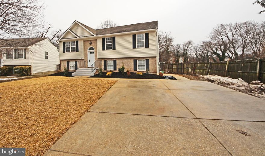 STUNNING Home with a Two Story Foyer,  6  BEDROOMS,  3 FULL BATHS  with Open Layout! MUST SEE: GOURMET KITCHEN WITH Hi-End Cabinets and ISLAND, STAINLESS STEEL APPLIANCES, French 3-Door Refrigerator, EXOTIC GRANITE, GLASS TILED BACKSPLASH. Living Room, and Dining Room and Hallway with GLEAMING Floors, Chair-Rail, CUSTOM 2-Tone Paint, High-End Light Fixtures Throughout. New Paint Inside and Outside, 6-Panel Doors.  ALL NEW BATHS with CUSTOM HI-END VANITIES and Mirrors, Lighting, EXQUISITE PORCELAIN TILED Walls and Floors. Lower Level has Large Rec Room, 3 Large Bedrooms, FULL Bath, Separate Large Laundry Room, Mechanical Room and HUGE Storage. Walk out (NEW SLIDING GLASS DOORS)  to a Large Flat Fenced in Backyard. Large Driveway! ONE YEAR HOME WARRANTY-Paid by the Seller at the Closing!