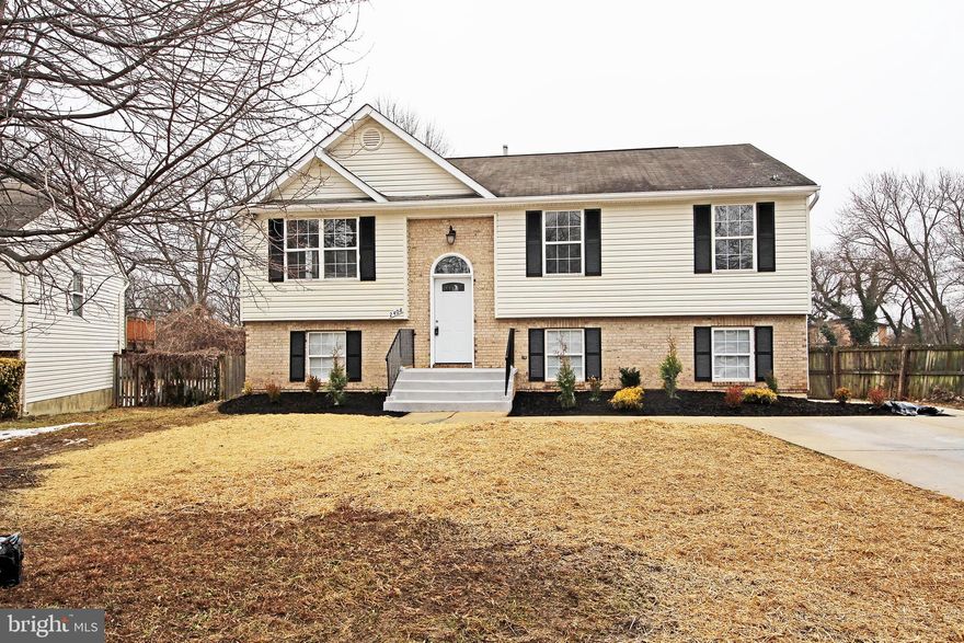 STUNNING Home with a Two Story Foyer,  6  BEDROOMS,  3 FULL BATHS  with Open Layout! MUST SEE: GOURMET KITCHEN WITH Hi-End Cabinets and ISLAND, STAINLESS STEEL APPLIANCES, French 3-Door Refrigerator, EXOTIC GRANITE, GLASS TILED BACKSPLASH. Living Room, and Dining Room and Hallway with GLEAMING Floors, Chair-Rail, CUSTOM 2-Tone Paint, High-End Light Fixtures Throughout. New Paint Inside and Outside, 6-Panel Doors.  ALL NEW BATHS with CUSTOM HI-END VANITIES and Mirrors, Lighting, EXQUISITE PORCELAIN TILED Walls and Floors. Lower Level has Large Rec Room, 3 Large Bedrooms, FULL Bath, Separate Large Laundry Room, Mechanical Room and HUGE Storage. Walk out (NEW SLIDING GLASS DOORS)  to a Large Flat Fenced in Backyard. Large Driveway! ONE YEAR HOME WARRANTY-Paid by the Seller at the Closing!