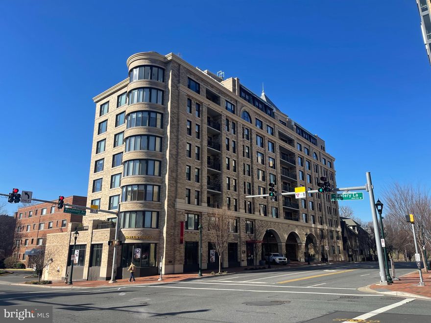 This stunning 2 bedroom, 2 full bath condo  located in the sought after Stonehall Condominium is certain to please.  Open floor plan includes spacious  living/dining room with two sliding doors to expansive balcony,  gourmet kitchen with white custom cabinets, quartz countertops, stainless steel appliances including 4 burner gas cooktop,  wall oven, refrigerator, dishwasher, built-in microwave and breakfast bar with installed television, which conveys.  The luxurious main bedroom suite includes full bath with glass-enclosed tub, 2 spacious storage cabinets and  large walk-in custom designed closet.  The second bedroom also boasts a custom closet and full bath in the hall.  Both bathrooms were upgraded after purchase with larger cabinets for more storage, updated chrome fixtures and faucets, lighted  mirrored medicine cabinets and space saving pocket doors. Decorator window treatments convey.  Custom wood office cabinetry in second bedroom is not attached and can convey if desired.  Pets ok with exceptions.  Building amenities include rooftop deck with garden, meeting/club room with outdoor terrace, and fitness center.  Two assigned parking spaces and storage unit.   Conveniently  located in downtown Bethesda directly across the street from Harris Teeter and near the new Marriott Headquarters, NIH, Walter Reed,  Trader Joes, walking paths, Battery Lane Park, two Metro stops, proposed Purple Line train stop, I-95, I-270, downtown DC, shops, restaurants and more.  A real beauty! (Offers due Tuesday 2/13/24 at noon)