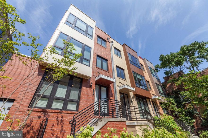 Like-new, 4-Level END UNIT townhome nestled in a small, well-maintained community. Step into the lower level featuring a 2-car garage, full bath, and bedroom that functions well as a HOME OFFICE. The perfect-for-hosting main level boasts an upgraded kitchen with an expansive island, bookended by a dining area and large, sun-lit living area with floor-to-ceiling windows. Enjoy prepping and serving homemade meals with the aid of high-end Kitchen Aid appliances. The living area showcases a large custom accent wall, providing the perfect backdrop for entertaining. Proceed to the next level where you'll find 3 well-lit bedrooms and 2 full bathrooms, including a large ensuite master with 2 walk-in closets. The home is capped by a spacious rec room with a powder room and a rooftop deck perched high above Cameron Station with panoramic views including the Masonic Temple and beautiful green space. The rec room is plumbed for easy addition of a wet bar. Other upgrades include up-and-down window treatments, quartz countertops in the kitchen, marble tile herringbone backsplash, dining area lighting feature, and a Samsung washer and dryer. Easy access to Van Dorn Metro, area parks, and local amenities. A convenients walkway connects the development to Cameron Station and the local park.