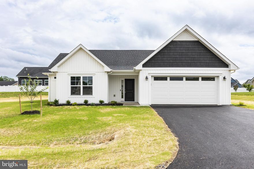 New construction rancher COMPLETE and ready for a quick move in.  This home is beside a conservation area, so there will be no neighbors on one side of you!! Located in Bridle Creek - this floorplan has an owners suite with a ceramic tile shower and shower door, plus two large secondary bedrooms and a second full bath.  Front door enters into a foyer, leaving you plenty of space between the door and your living area.  Kitchen has a large island with room for seating, a pantry and a separate dining area!  Sliding glass door takes you out back to a large covered concrete porch which is positioned for privacy and perfect to enjoy the view of the open land beside your lot.  Washer and Dryer has its own dedicated walk in room.  Two car garage with a newly seeded yard with lush grass already growing!