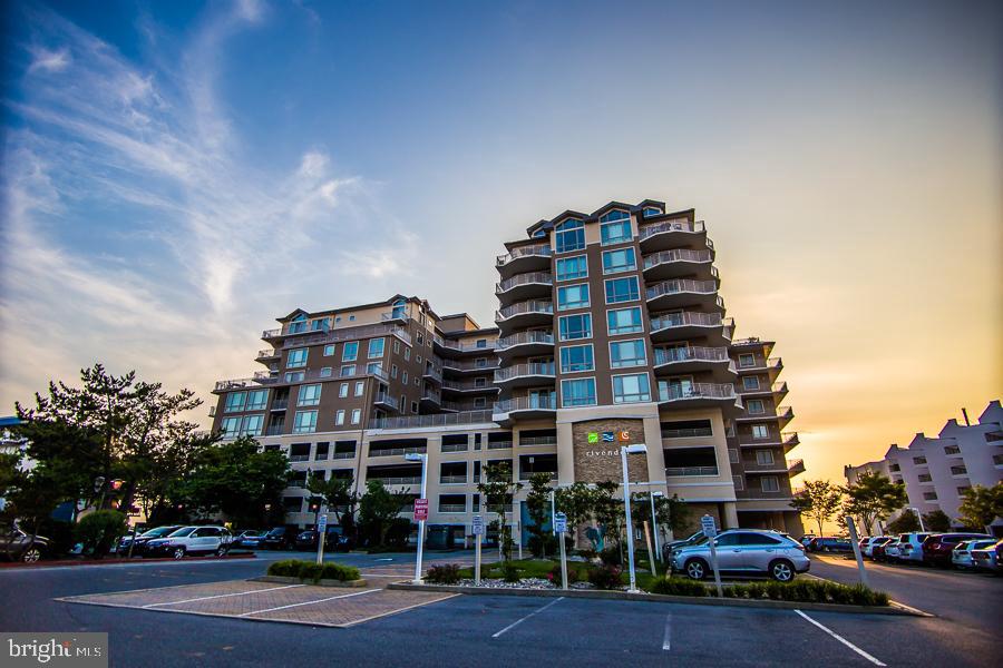Don't miss out on one of the nicest units in one of Ocean City's finest bayfront buildings. Experience ocean views without paying oceanfront prices. Enjoy all the awesome amenities in this wonderful building including The Hobbit restaurant on the ground level. This 3 bed, 3 1/2 bath unit boasts great finishes including stainless appliances, granite counter tops and tiled flooring throughout with carpeted bedrooms. It also features a wet bar and an electric fireplace for those chilly evenings. Experience both breathtaking sunrises sunsets from your wrap around balcony.