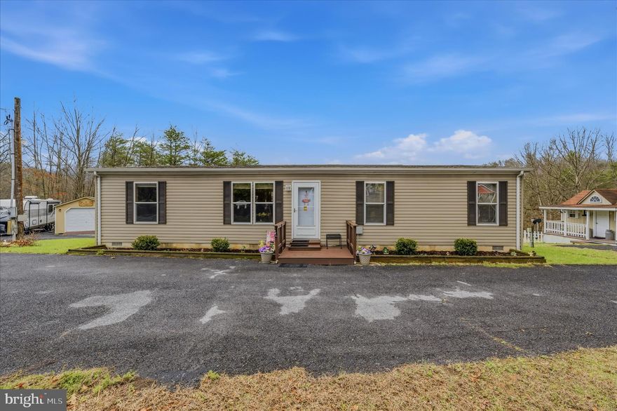 This 3 bedroom 2 bath rancher has a lot to offer! Open kitchen/dining room, washer/dryer in utility room with easy access, well cared for home build in 2020 with a detached 1 car garage, multiple sheds, even a charming tiny home with sink/toilet, perfect for guests! There is also a spot for an RV hookup with utilities! So much to offer, and UNRESTRICTED! Plenty of backyard and nice views. Really feels quiet and out in the country while just minutes from downtown Berkeley Springs, just off 522. This is a really great opportunity with a lot of extras you won't find elsewhere. Owner occupied so please be respectful and schedule a showing with your agent.