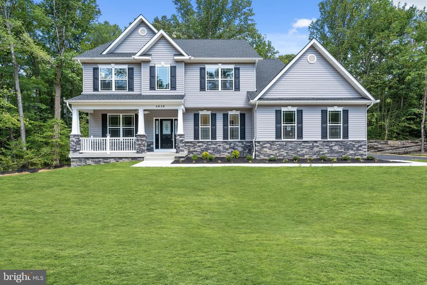 Move in ready new construction coming this spring! Located at 24850 Peaceful View Way in Hollywood, MD, this 4-bedroom home sits on a private 1.5-acre cul-de-sac lot, offering space, privacy, and modern farmhouse-inspired design.
The exterior features stone skirting, a side-entry garage, and a welcoming front porch. Inside, the home is designed with high ceilings, upgraded trim details, luxury vinyl plank flooring, and a gas fireplace in the great room. Finishes, materials, and selections are subject to change at the builder’s discretion.
Just off the foyer is a formal dining room that may also function well as a private study or home office. The rear of the home offers a bright, open-concept layout with a spacious great room, dining area, and kitchen ideal for everyday living and entertaining. The kitchen includes stainless steel appliances, ceiling-height cabinetry, a large center island, and breakfast bar seating, with sliding doors leading to the backyard.
Upstairs, all four bedrooms are thoughtfully positioned for privacy. The primary suite occupies its own wing and features a walk-in closet and ensuite bath with dual sinks, private water closet, and custom-tiled shower. A second full bath includes double sinks with a separate shower and toilet area.
The unfinished basement provides room to expand and includes a 3-piece rough-in for a future full bath. Additional highlights include a main-level powder room, spacious laundry room, and ample storage throughout.
Situated in a quiet neighborhood with large lots, this home offers a peaceful setting while remaining convenient to local amenities. Buyers with an existing lot or those considering building on another lot may inquire about additional build opportunities.