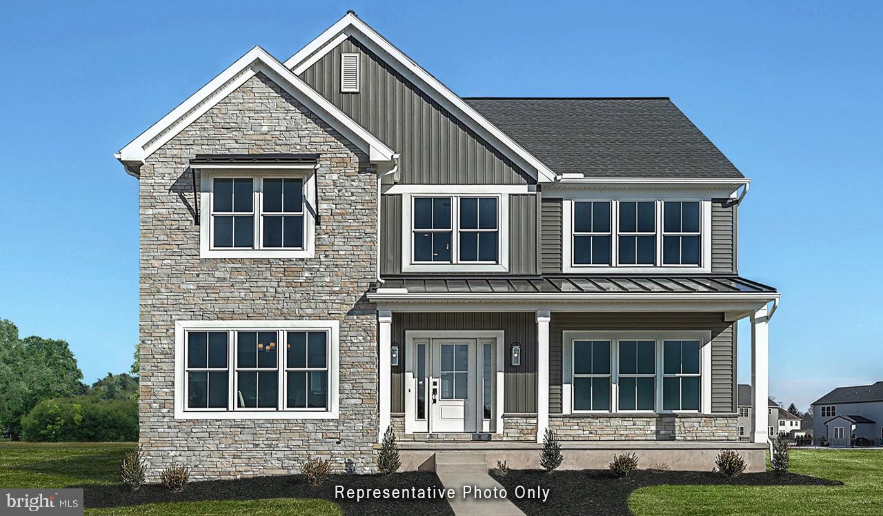 This 2-story home is well-equipped with 9’ ceilings on the first floor and a 2-car, rear load garage with a mudroom entry complete with built-in lockers, closet, and powder room. A beautiful front porch to the front of the home opens to the foyer, flanked by a dining room and carpeted flex space. Stylish vinyl plank flooring flows throughout the main living areas. The kitchen features enhanced cabinetry and appliances, quartz countertops with a tile backsplash, and an island for entertaining. Adjacent to the kitchen is a butler’s pantry and large food pantry. The family room, warmed by a gas fireplace with floor to ceiling stone, is adjacent to the breakfast area that provides access to the covered patio. A convenient laundry room, loft, 3 secondary bedrooms and a full bathroom are located on the 2nd floor. The owner’s suite boasts an expansive closet and a private bathroom with double bowl vanity and tile shower.