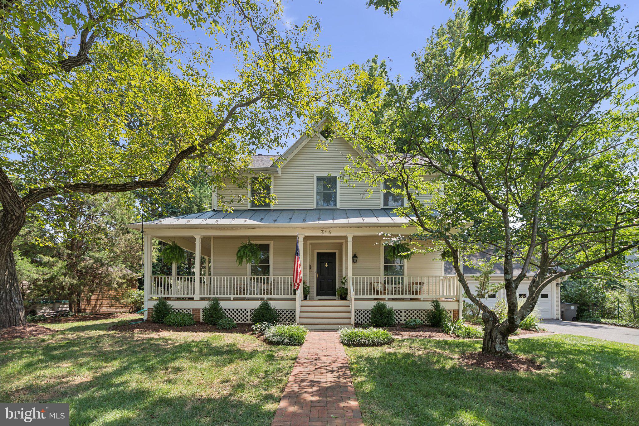 Welcome to 314 Beall Avenue — A Downtown Rockville Gem! Perfectly nestled in the heart of Downtown Rockville, this modern colonial offers the charm of the historic West End with all the benefits of newer construction. Built in 1993, this beautifully designed home blends seamlessly with its classic neighbors while offering just over 4,000 square feet of modern living space across three finished levels. With four bedrooms, three full bathrooms, a main-level powder room, and an attached two-car garage, this home truly checks every box.
From the moment you arrive, you’ll fall in love with the inviting wrap-around front porch and detailed exterior design that give this home standout curb appeal. Just a short stroll to Rockville Town Square and the Metro, this location offers walkable access to shopping, dining, and transit, truly a rare find.
Step inside to find an open and airy floor plan with gleaming hardwood floors, new designer light fixtures, and natural light streaming in from windows on all four sides. The spacious dining area flows effortlessly into the refreshed kitchen, complete with quartz countertops, new KitchenAid and Bosch stainless steel appliances, upgraded cabinet hardware, and a large island. A sunny breakfast area overlooks the backyard and connects directly to the back patio, making entertaining a breeze. This level also includes a powder room, laundry closet and convenient access to the oversized two-car garage, perfect for all your storage needs.
The upper level features four generously sized bedrooms and two full bathrooms. The light-filled primary suite boasts vaulted ceilings, a large walk-in closet, and a luxurious en-suite bath with a double vanity, a large soaking tub, oversized walk-in shower, and private water closet. The additional bedrooms all offer ample closet space and share a full hallway bath with stylish updates. The fully finished lower level offers incredible flexibility, with a spacious recreation room, full bathroom, and a bonus room that’s ideal for a guest suite, home gym, or private office.
Enjoy unbeatable walkability to all that Downtown Rockville has to offer—Trader Joe’s, Kusshi Sushi, Guiseppi’s Pizza Plus, Regal Cinemas, Starbucks, Potbelly, Gold’s Gym, VisArts Center, Cottage Monet, Marble Slab Creamery, and more! Just one block to Walsh park and the Rockville Swim Center with a gym, two pools, and an outdoor pool with a water park. Commuting is a breeze with the Rockville Metro (Red Line) just blocks away, and easy access to I-270 and I-495 within minutes, and walkable to Beall Elementary School and Julius West Middle School. Don’t miss this rare opportunity to own a beautifully maintained home in one of Rockville’s most sought-after locations. Schedule your tour today and make 314 Beall Avenue your forever home!