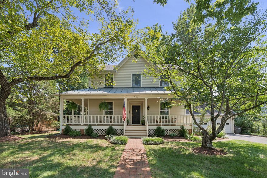 **Open House Sunday Cancelled! Welcome to 314 Beall Avenue — A Downtown Rockville Gem! Perfectly nestled in the heart of Downtown Rockville, this modern colonial offers the charm of the historic West End with all the benefits of newer construction. Built in 1993, this beautifully designed home blends seamlessly with its classic neighbors while offering just over 4,000 square feet of modern living space across three finished levels. With four bedrooms, three full bathrooms, a main-level powder room, and an attached two-car garage, this home truly checks every box.

From the moment you arrive, you’ll fall in love with the inviting wrap-around front porch and detailed exterior design that give this home standout curb appeal. Just a short stroll to Rockville Town Square and the Metro, this location offers walkable access to shopping, dining, and transit, truly a rare find.

Step inside to find an open and airy floor plan with gleaming hardwood floors, new designer light fixtures, and natural light streaming in from windows on all four sides. The spacious dining area flows effortlessly into the refreshed kitchen, complete with quartz countertops, new KitchenAid and Bosch stainless steel appliances, upgraded cabinet hardware, and a large island. A sunny breakfast area overlooks the backyard and connects directly to the back patio, making entertaining a breeze. This level also includes a powder room, laundry closet and convenient access to the oversized two-car garage, perfect for all your storage needs.

The upper level features four generously sized bedrooms and two full bathrooms. The light-filled primary suite boasts vaulted ceilings, a large walk-in closet, and a luxurious en-suite bath with a double vanity, a large soaking tub, oversized walk-in shower, and private water closet. The additional bedrooms all offer ample closet space and share a full hallway bath with stylish updates. The fully finished lower level offers incredible flexibility, with a spacious recreation room, full bathroom, and a bonus room that’s ideal for a guest suite, home gym, or private office.

Enjoy unbeatable walkability to all that Downtown Rockville has to offer—Trader Joe’s, Kusshi Sushi, Guiseppi’s Pizza Plus, Regal Cinemas, Starbucks, Potbelly, Gold’s Gym, VisArts Center, Cottage Monet, Marble Slab Creamery, and more! Just one block to Walsh park and the Rockville Swim Center with a gym, two pools, and an outdoor pool with a water park. Commuting is a breeze with the Rockville Metro (Red Line) just blocks away, and easy access to I-270 and I-495 within minutes, and walkable to Beall Elementary School and Julius West Middle School. Don’t miss this rare opportunity to own a beautifully maintained home in one of Rockville’s most sought-after locations. Schedule your tour today and make 314 Beall Avenue your forever home!