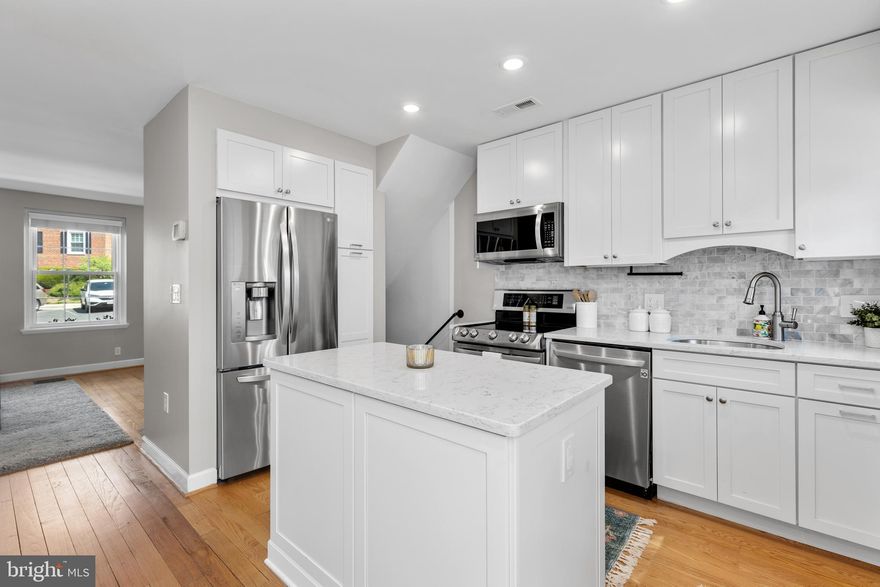 Gorgeous 2-bedroom, 2-bathroom Clarendon II townhome nestled in sought-after Fairlington Villages! A welcoming entry with a convenient coat closet opens into the spacious living room, featuring gleaming hardwood floors & neutral paint throughout the main level. The renovated open kitchen is a true highlight, showcasing soft-close white cabinetry with under-cabinet lighting, stainless steel appliances, quartz countertops, & a stunning tile backsplash. A separate dining area with recessed lighting overlooks the private back patio - perfect for everyday living & entertaining.

Upstairs, the hallway includes a linen closet for added storage. The updated bathroom features a stone-topped vanity, medicine cabinet mirror, over-toilet storage, & an updated tiled shower with niche shelving. The spacious primary bedroom offers a ceiling fan with overhead lighting & a walk-in closet, while the 2nd bedroom includes a generously sized closet with shelving. The lower level expands your living options with updated LVP flooring & recessed lighting throughout the oversized recreation room. You’ll also find an under-stair storage/utility closet, an additional nook with a storage cabinet, & a convenient laundry closet with a newer full-sized washer and dryer (2024) + overhead shelving. The fully renovated lower-level bathroom is beautifully finished with patterned tile flooring, a stone-topped vanity, & a large white tiled shower with sliding glass doors, a corner bench, & niche shelving.

Other home features include a floored attic that provides valuable additional storage space & two reserved/unassigned parking spaces. Fairlington Villages residents enjoy exceptional amenities including six pools, lighted tennis courts, tot lots/playgrounds, walking paths, & MORE. Ideally located near I-395 and just minutes to The Village at Shirlington, West Alex, Baileys Crossroads, Del Ray, and Old Town - offering unbeatable convenience to shopping, dining, & commuting options.