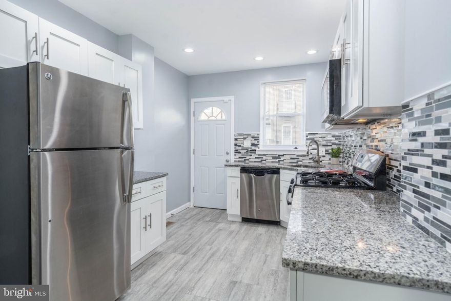 PICTURE PERFECT ROWHOME WITH OVER 1,700 SQ. FT. OF LIVING SPACE!  Features include a spacious living room and separate dining room with gleaming hardwood floors, designer kitchen with granite counters, ss appliances, and tile backsplash, main level half bath, upper level Primary bedroom suite with full bath and 2 additional bedrooms with a hall bath, finished basement with a family room and bonus room, & a rear fenced patio.  New roof installed in 2021 & the  HVAC system, water heater, kitchen appliances, and washer/dryer are only 3years old!  Property is part of the voluntary Harwood Community Association which was created to support and bring neighbors together through community events, community gardens, and neighborhood block parties!