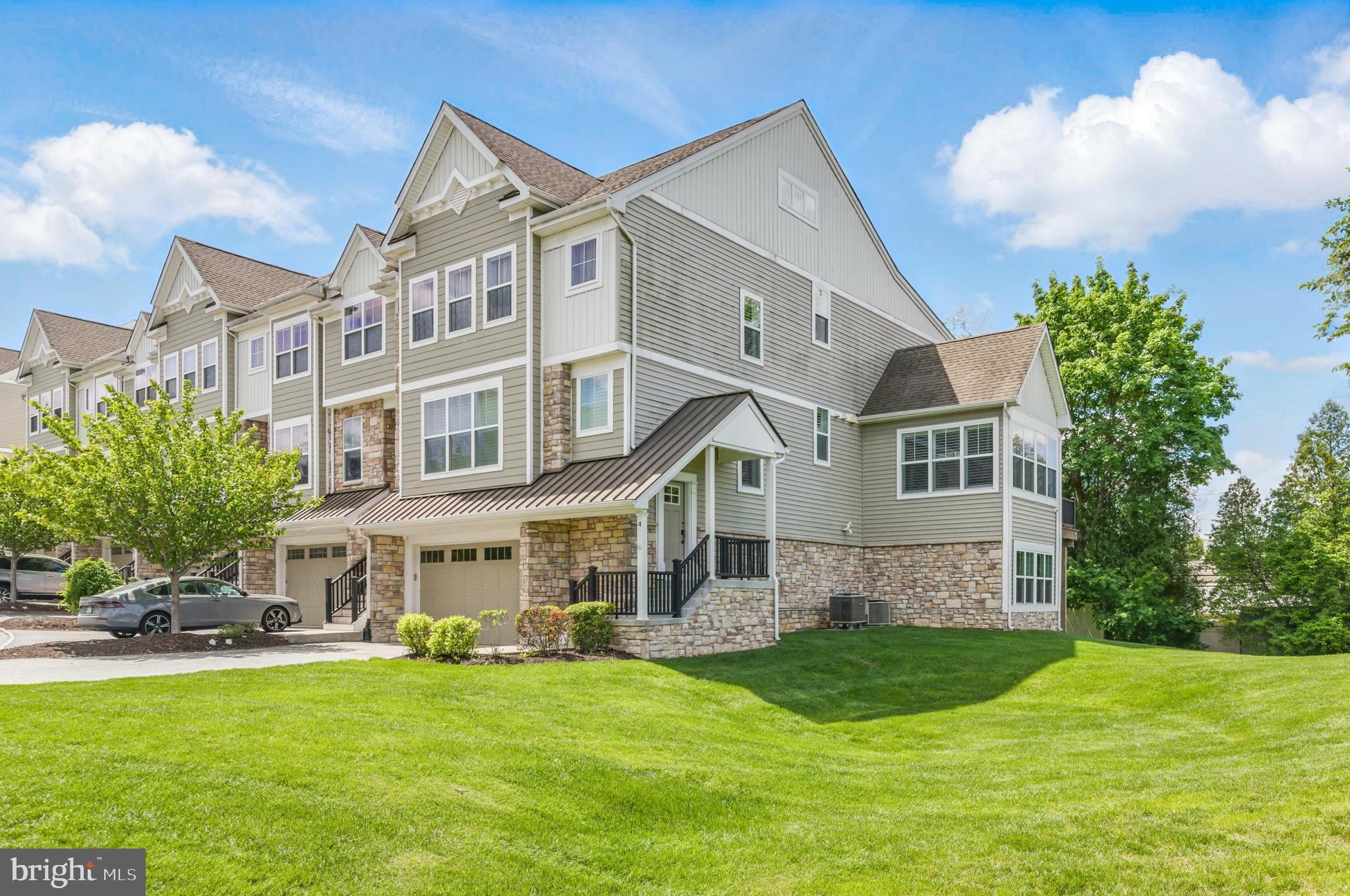 Welcome to 4 New Countryside Drive, offering over 4,000 square feet of modern, luxurious living space just 5 minutes from West Chester Borough. This exceptional end-unit townhome with oversized 2 car garage feels like new construction, showcasing a modern, open-concept layout paired with high-end finishes throughout and maintenance free living.
At the heart of the home is the chef’s dream kitchen, complete with upgraded quartz countertops, an oversized island, and custom 42" white cabinetry accented by under-cabinet lighting. Premium appliances include double wall ovens, built-in drawer microwave, and wine and beverage fridge, perfect for hosting, relaxing and entertaining. The kitchen opens into the spacious living room with custom floor-to-ceiling built-ins and a cozy gas fireplace, while a thoughtfully designed home office with custom barn doors, including it's own balcony and a built-in gas line for grilling. Elegant hardwood floors flow throughout the main living areas, hallway and stairwell with recessed lighting in the entire space, including all bedrooms and closets.
Fresh paint throughout and upgraded window treatments complete the space.
Upstairs, you’ll find a large primary suite with 2 walk in closets, sitting area and spa-like tile bathroom with double vanities. Two generously sized secondary bedrooms with a luxurious tile hall bath, and large laundry room on the second level. A gorgeous loft with tons of natural light and two walk-in closets offers flexibility as an entertaining space with balcony, a fifth bedroom or a second home office.
The fully finished walk out lower level, sits at grade and boasts a mudroom off the garage. A large living area, full bath, private gym with professional-grade rubber flooring, sizable bedroom and walkout access to a secluded rear yard—ideal for an in-law or guest suite with no-step entry and easy-access shower.
Smart home features include a custom security system with cameras, Nest thermostat, and 2 zoned HVAC to ensure optimal comfort on all levels. The upgraded railing and spindle package adds a final touch of sophistication throughout the home. Don't miss this rare opportunity, schedule your private showing today.