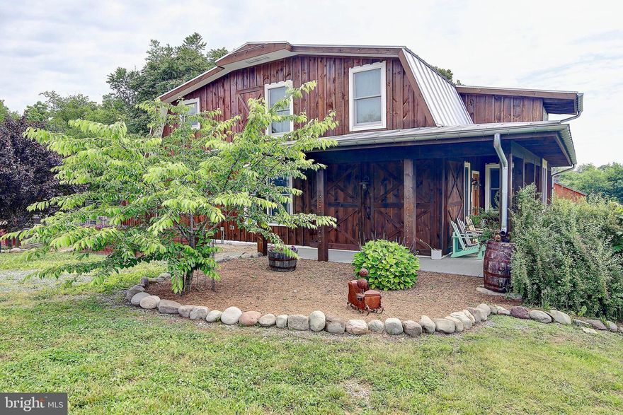 THIS ONE-OF-A-KIND, GORGEOUS 8 ACRE PROPERTY IN THE BEAUTIFUL SHENANDOAH VALLEY IS ALMOST HEAVEN! Perfect property for horses, a homestead, a rural retreat or even a wedding venue.        Beautiful views of the property and the Blue Ridge Mountains  2 Master suites; 2.5 Bathrooms        Artist s Studio or Office and Den, Large Storage Areas, and a Working Pantry Custom woodwork throughout        First Floor Wet Bar/Kitchenette        Net Zero Home with Solar Panels and Back-up Battery System (no electric bills or power outages)         Large, Recently Refurbished Deck for Lots of Space to Entertain and Take in the Incredible Views  Very private and yet minutes away from historic Shepherdstown, Charles Town and Harpers Ferry. The Shenandoah and Potomac rivers, Appalachian Trail, Antietam Battlefield, and Harpers Ferry Park are 15   20 minutes away for hiking, kayaking and picnicking. The commuter train to metro Washington DC and northern suburbs is 7 minutes away. Very close to good schools and shopping. High speed internet as well as satellite TV  Fully fenced with 5 well-maintained pastures, 4 run-in sheds, a large monitor barn with upstairs storage and hay loft, a riding arena, 2 chicken coops, and an acre with 7 foot fencing surrounding a raised bed garden and orchard that produces peaches, apples, pears, cherries, blackberries, blueberries, raspberries, figs and hazelnuts.  In organic production since 2011. Zoned agricultural.