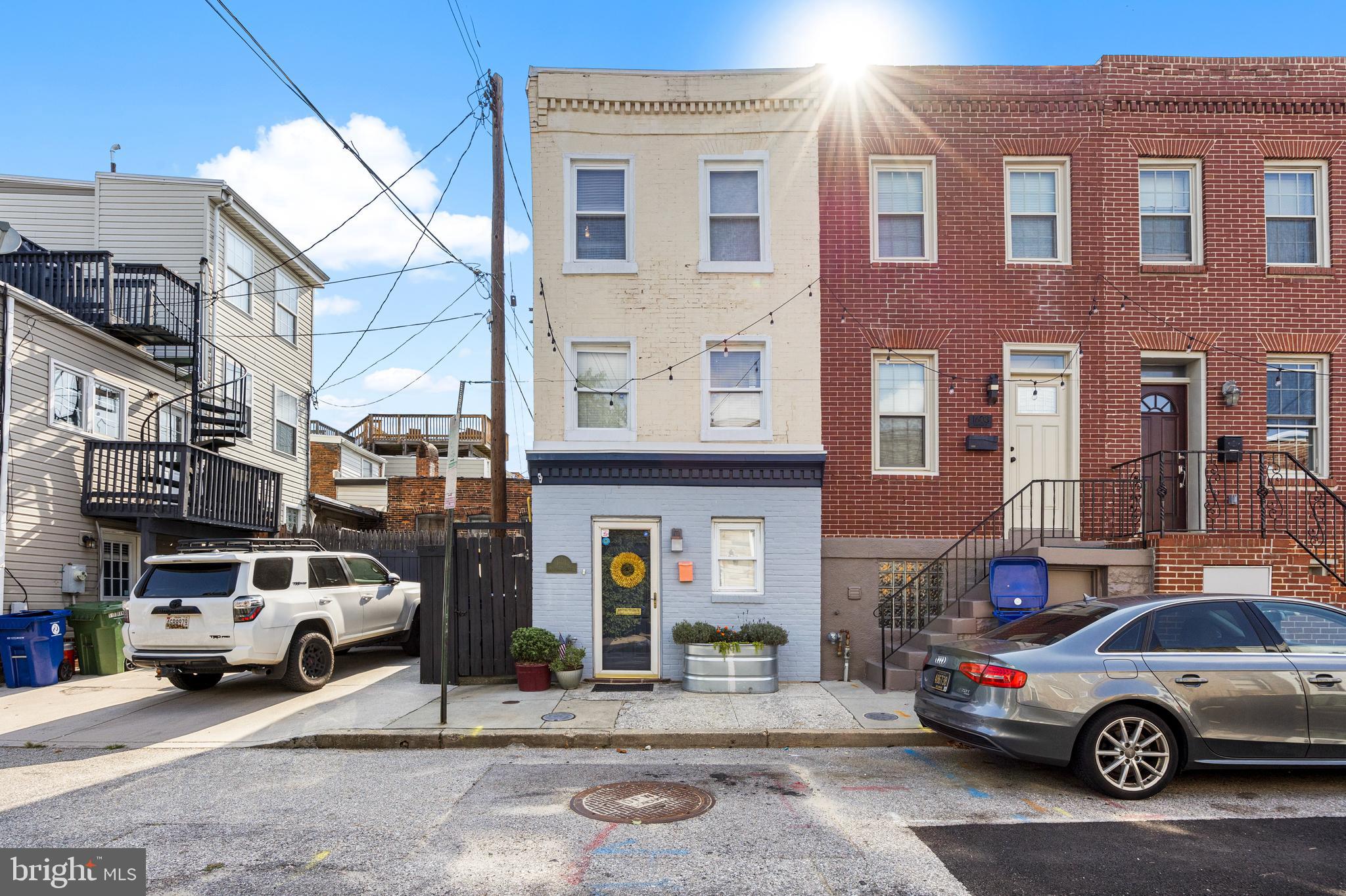 Don’t miss out on this cozy two bed, two bath end unit. With tons of natural light, a secluded courtyard style rear patio and updated features throughout, this home feels like a private sanctuary right in the heart of Federal Hill. Upon entering you will notice a bright, trendy kitchen featuring open faced shelving, new countertops, and a subway tile backsplash. The fully fenced in backyard features patio space for el fresco dining as well as garden beds! Heading upstairs you will find the first bedroom and full bath as well as a second floor laundry area which is very convenient. Continuing up to the third floor you have the second bedroom and full bath. This home is walking distance to many restaurants, bars, stadiums, federal hill park, and local museums. It’s sure to be a great starter home for exploring the city and creating memories! Recent updates include roof 2024, HVAC 2024, hot water heater 2019.