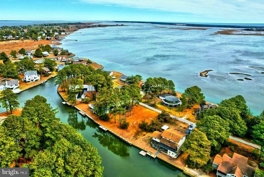 One-of-a-kind rare find! Large vacant waterfront lot in Oyster Bay I! Over 100 feet of canal frontage with amazing BAY VIEWS on Chincoteague Island... NEW BULKHEAD in 2019 -- new private dock -- on a cleared lot. If you can't find it, you can certainly have it built the way you desire! 4BR septic approved... A nice community with boat ramp and crabbing and fishing pier! Nestled in nature, Oyster Bay is a desirable island community!