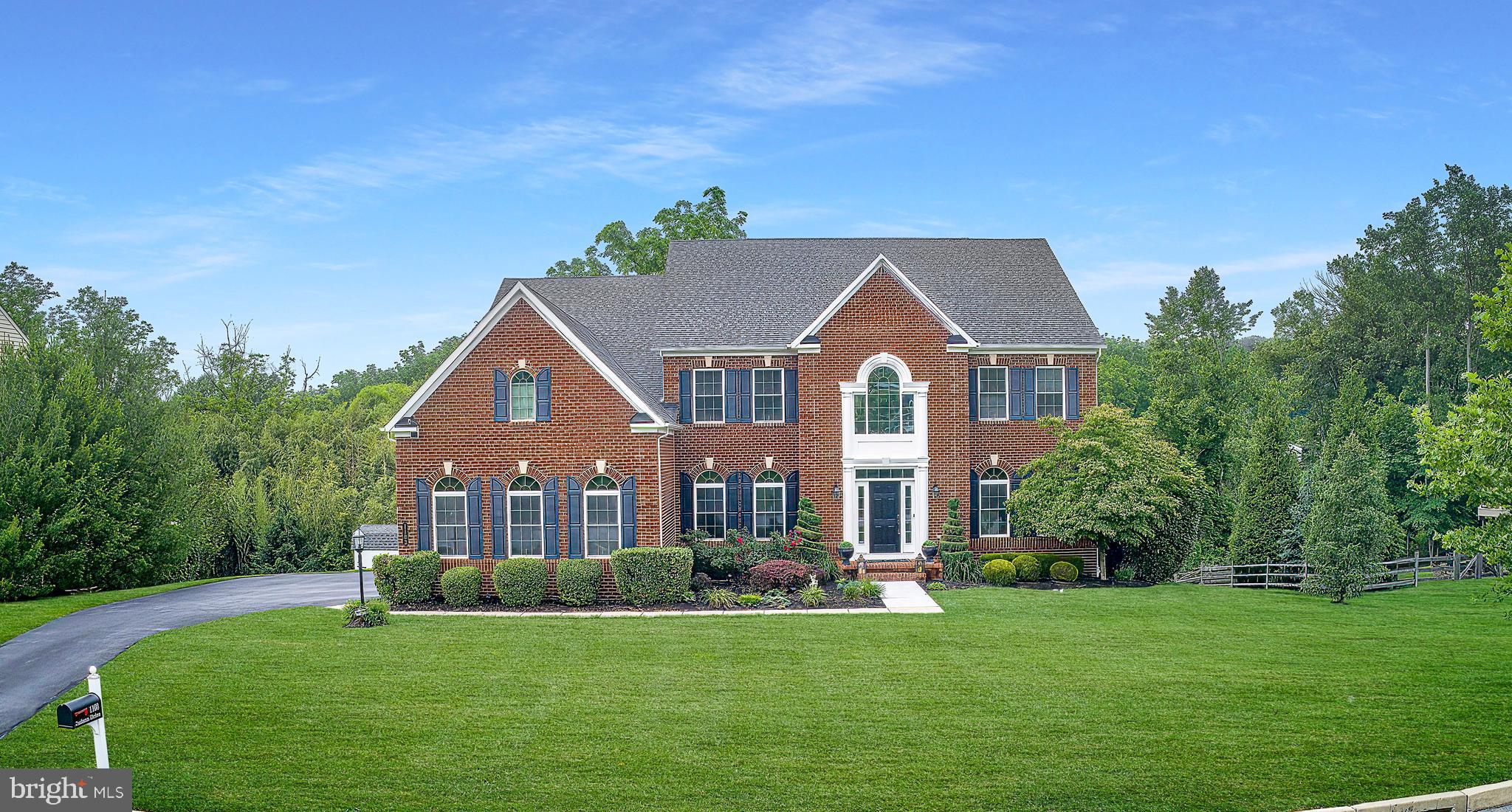 Step into nearly 5,000 square feet of refined living in this custom-built brick and beaded siding traditional home, where timeless elegance meets everyday comfort. A dramatic two-story foyer with dual staircases welcomes you into a sun-drenched interior designed for both grand entertaining and relaxed daily life.
The main level offers a seamless flow, featuring formal living and dining rooms with detailed crown molding, arched windows, and tray ceilings. The dining room is further enhanced with elegant chair rail molding. A butler’s pantry connects the dining room to the chef’s kitchen, offering added convenience and style for entertaining. The kitchen is outfitted with granite countertops, stainless steel appliances, double wall ovens, a stone tiled backsplash, and a bright morning room with access to the rear deck. A spacious family room with a custom built in , coffered ceiling and propane fireplace anchors the main living space. Gleaming hardwood floors extend throughout the first floor, with the exception of the study and living room. Additional highlights include a private home office, powder room, rear staircase, laundry room, abundant storage and a water softening system.
Upstairs, the luxurious primary suite is a true retreat, featuring a tray ceiling, dual vanities, an oversized glass shower with dual showerheads, soaking tub, private water closet, and two custom walk-in closets. Three additional bedrooms provide generous space, including a princess suite and a Jack-and-Jill bath—each with upscale finishes and thoughtful details.
The fully finished daylight walk-out lower level adds over 1,600 square feet of flexible living space, perfect for entertaining, guests, or multi-generational living. It features a stylish bar area with a stainless steel dishwasher, stainless beverage refrigerator, and glass display cabinets, along with open recreation areas and a powder room.
Built in 2012 and meticulously maintained, this home also includes a 3-car garage, recently replaced Trane HVAC systems with AprilAire, a 20 KW Generac generator, a custom Christmas light package, recessed lighting throughout, and ceiling fans with lights in every bedroom.
Located in the highly rated West Chester Area School District and just 1 mile from Chester County Hospital, 2 miles from the shops, dining, and nightlife of downtown West Chester, and with convenient access to Routes 322 and 202—this is luxury living in a location that truly delivers.
***Don't miss our exclusive website for this home, featuring a 3D Matterport tour, Virtual Reality Walkthrough, detailed floor plan, professional photography, aerial drone neighborhood footage. Note: Some photos have been digitally enhanced.***