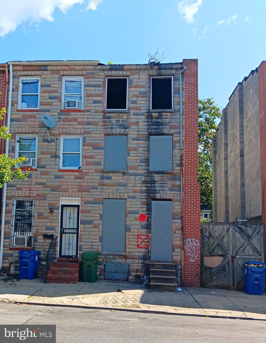 Welcome to this end of the group townhome in the vibrant neighborhood of  Hollins Market! This three level brick home with 3 bedrooms, a full bathroom and an unfinished basement. is great addition to any investor's portfolio to renovate as this area continues to develop. The property offers prime access to business activity and daily conveniences.