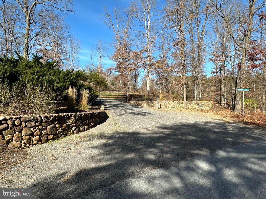 TO APPREICATE THE BEAUTIFUL LAYOUT, VIEWS AND EVERYTHING THIS PROEPRTY OFFERS, YOU MUST WATCH THE COMPREHENSIVE VIDEO TOUR. CONTACT LISTING AGENT FOR A LINK IF NEEDED. Is acreage, privacy, unlimited building potential or family compound/family development land on your checklist? This property may be it! Located in Allegany County near Oldtown, Maryland just 2.5 miles from the South Branch of the Potomac River and the storied C&O Canal, you’ll find this rolling, improved, wooded 218 acres. Turning off of Lower Town Creek Road, you’ll pass through the security gate and enter Borrowed Time Lane. This private, well maintained gravel road (with erosion control berms) will eventually lead you about one mile through gradual hills, valleys, gentle turns, and beautiful views back to the main dwelling. The first stop along the way is the previous in-law dwelling which is an 1,146 square foot manufactured home on its own well and septic with NEW METAL & SHINGLE ROOF. Here you’ll find a primary bedroom, en-suite bath, guest bedroom, another full bathroom, inviting living room area, combination kitchen/dining area, screened rear deck area, bonus room and laundry closet. Once updated, this dwelling could continue to be used as an in-law residence, au-pair residence, guest residence or combination/consolidation family residence. Continuing on, your next stop will be the 1,400 square foot poultry/animal pen offering beautiful valley views and plenty of room for expansion. The next stop along the way features a 24x16 equine/animal barn as well as a 1.5 acre fenced corral. If horses or animals are on your checklist, this is set up and ready to go. How does one maintain all of this beautiful land? With the 1,176 square foot pull-through pole barn/maintenance building offering plenty of room for your maintenance equipment, four-wheelers, loaders, etc. Last but certainly not least is the 1,980 square foot main residence. This was intended to be the owner’s temporary residence as he built his dream home but as sometimes happens, circumstances change and that was never started. This can now be your opportunity to pick up where he left off and select the location, size and attributes of your dream home on this beautiful property. Whether you build an additional home or are happy living here, you’ll find that this dwelling offers an open kitchen/dining/flex space area, wood stove, sunken living room area, office area, laundry/utility room, 2 full bathrooms, 4 bedrooms, well and septic as well as a NEW METAL ROOF.  Note that room counts and square footage are for both dwellings.  Currently in Agriculture/Forestry Conservation Program. Can be subdivided into 10 (1) acre parcels if taken out or 6 acres if left in.  Sound like this property may have what it takes for your needs?  Initial showings will require a 48-hour advance notice and require either proof of funds (if cash buyer) or verified pre-approval prior to scheduling. Please contact listing agent to arrange. Initial showings will entail a preview of the property and access to all buildings.  The owner will meet buyers and their agent at the entrance gate for access.  A follow-up showing can then be arranged with the owner to ride the property boundaries and trails if desired.