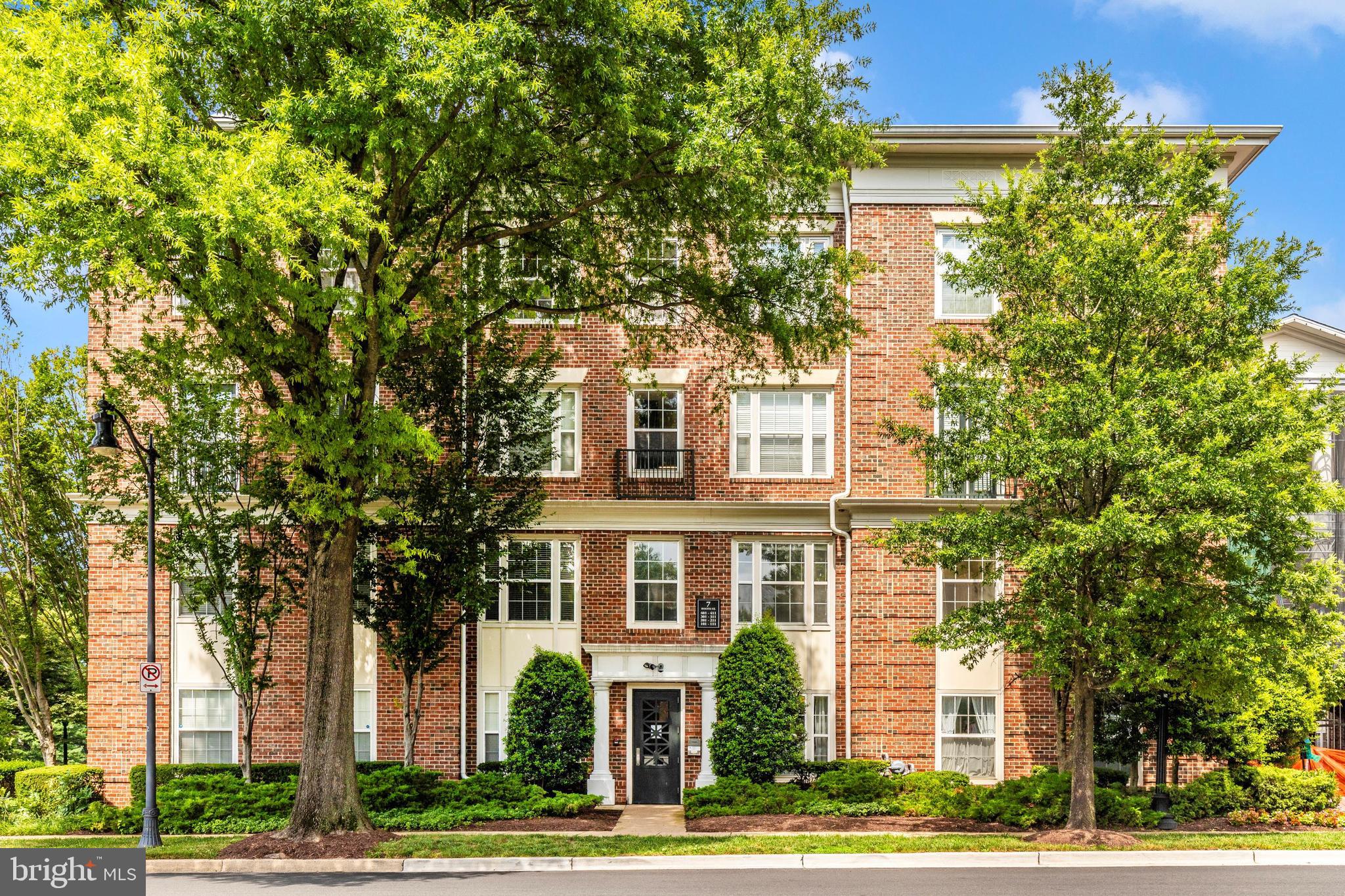 Discover Elevated Living at The Colonnade at Kentlands!!! Nestled on the serene side of the street, this meticulously maintained 3-bedroom, 2-bathroom corner unit offers over 1,600 sq ft of sophisticated living space in the heart of the highly sought-after Colonnade at Kentlands. Upon entering, you're greeted by a grand foyer adorned with crown molding and wainscoting, setting the tone for the home's elegance. The expansive open-concept design is bathed in natural light, highlighting the gleaming hardwood floors that flow seamlessly throughout the living and dining areas. The gourmet kitchen is a chef's delight, featuring stainless steel appliances, gas range, ample cabinetry, and a breakfast bar that opens to the spacious living room. Cozy up by the gas fireplace or entertain guests in the formal dining room, both offering a warm and inviting atmosphere. Retreat to the private owner's suite, complete with direct access to a tranquil balcony, a spacious walk-in closet, and an en-suite bath with dual vanities. On the other side of the condo find two additional generously sized bedrooms with large closets share a full bath with a dual sink vanity. Convenience is key with an in-unit washer and dryer, enhancing everyday functionality. Step outside to the private balcony and enjoy your morning coffee or unwind with fresh air and elevated views. Living on the quiet side of the street ensures your peaceful moments are undisturbed. This unit also includes two assigned garage parking spaces. Residents of The Colonnade enjoy resort-style amenities, including a two-level fitness center with a sauna, an outdoor swimming pool with a whirlpool, a media room with a big-screen TV, a wine tasting room, a library, and Max’s Pub, which features billiards and a party space. Community events such as dinners, a Super Bowl chili cook-off, and an annual pool party foster a vibrant neighborhood atmosphere. Situated less than a mile from Downtown Kentlands, residents have easy access to premier shopping, dining, and entertainment options, including Whole Foods, Cinepolis Luxury Cinema, and vibrant community events like the farmer’s market and Oktoberfest. This meticulously maintained condominium offers a blend of luxury, convenience, and community, making it an ideal choice for discerning buyers seeking an elevated living experience.