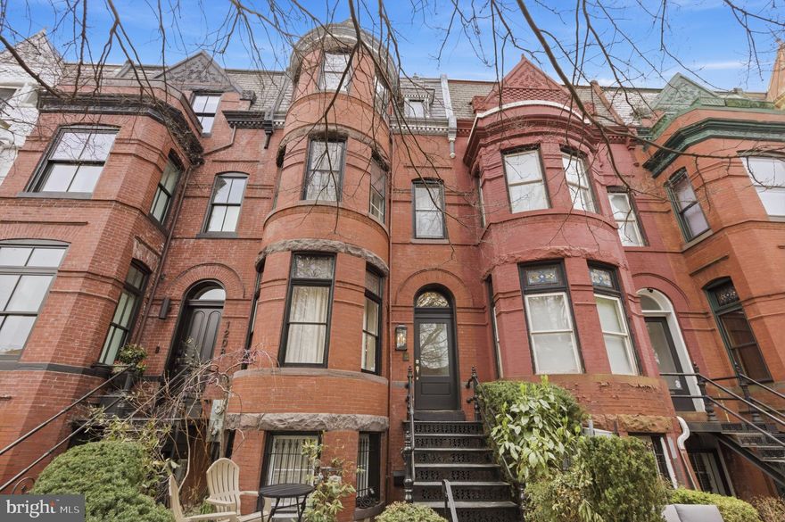 Welcome to 1210 T Street NW — Where Historic Charm Meets Modern Living in the Heart of the City
Perfectly positioned just two blocks from the U Street Metro and steps from the energy of Logan Circle and the 14th Street corridor, this fully renovated four-level rowhouse offers the best of Washington DC living without sacrificing a single drop of character.
From the moment you step inside, the home's rich history reveals itself in the details — original wood trim & stained glass windows, that speak to the craftsmanship all seamlessly woven into a thoughtfully modernized interior. This is not a gut renovation that erased the past; it's one that honored it.
The main level is designed for those who love to entertain. Dramatic accordion glass doors span the rear of the home and fold completely open, dissolving the line between indoor and outdoor living and leading directly to your private rear deck — perfect for al fresco dining, morning coffee, or evening gatherings under the city sky. With some of DC's best restaurants, boutiques, and neighborhood favorites all within walking distance, you may never want to leave — but when you do, the Metro is practically at your doorstep.
Upstairs, four generous bedrooms and three full bathrooms provide space for everyone, anchored by a stunning primary suite with an ensuite bathroom that feels more spa than city home. The top floor crowns the property with a private roof deck complete with a wet bar — your own elevated retreat above the rooftops of one of DC's most coveted neighborhoods.
Out back, the dedicated parking space offers the rare urban luxury of coming home without circling the block.
The separately metered English basement rounds out this exceptional property as a true bonus — whether you envision it as a private in-law suite, a guest apartment, or an income-producing rental unit, the flexibility is entirely yours.
Homes like this — where location, history, renovation quality, and livability all converge — simply do not come along often. 1210 T Street NW is ready for its next chapter. Will it be yours?