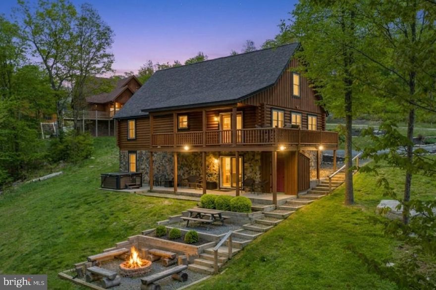 Here’s your opportunity to own a spacious 6-bedroom, 4-bath log home nestled in the heart of the mountains of McHenry MD. This impressive property offers an unbeatable combination of rustic charm and modern comfort, making it perfect as a primary residence, vacation home, or investment rental. Situated near Wisp Resort and Deep Creek Lake, the Alpine Lodge is ideal for year-round enjoyment, whether it’s skiing in winter or relaxing by the fire pit on cool summer nights. Property features include:  Open Floor plan, Gourmet Kitchen equipped with modern appliances, Game room with pool table, shuffleboard and private out door hot tub and firepit.   Located minutes from Wisp Resort, the home offers quick access to skiing, zip-lining, and mountain biking. Nearby attractions also include Adventure Sports Center International (ASCI) recirculating white water rafting course,  golf courses, and marinas for water sports enthusiasts.  The property is currently a rental through Railey Vacations, making it a smart investment for those seeking a property to utilize for family enjoyment and income opportunities.  Perfect blend of luxury, comfort, and adventure.  Property is turn key!  Exterior recently stained.  Contact us today to schedule a private tour and make this beautiful log home your own!  All serious offers will be thoughtfully considered. Seller is open to negotiation within reason.