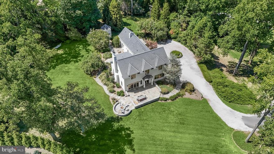 Sitting high above the second and third holes of the Gibson Island Club Golf Course is a beautifully renovated and expanded traditional home with beyond spectacular views of the Gibson Island Harbor, the Chesapeake Bay, and the Gibson Island Club Golf Course. On 2.7 acres, this four/five-bedroom, three full bath, three half bath, 4,592 square foot property is virtually turnkey. With one of the best views on the Island, gorgeous landscaping, and wonderful living spaces, both indoors and out, along with a huge garage, this fabulous property is ideal for entertaining family and friends and enjoying the Gibson Island lifestyle.
With the golf course on either side of a long winding driveway, one arrives at the property. With plenty of parking in the circular driveway, ascend stone steps to a beautifully hardscaped large stone walled patio with firepit overlooking the Harbor, the Bay and the Gibson Island Club Golf Course. Enter the front door with covered entryway to a center hallway where to the left is a magnificent great room with a large stone, woodburning fireplace, and a substantial eat-in kitchen on the right, both rooms providing stunning panoramic views of the Gibson Island Harbor, Chesapeake Bay and Club Golf Course.
On the main level adjacent to the kitchen is a large dining room with a woodburning fireplace with special decorative marble surround with multiple double doors opening to the rear terrace, simply perfect for entertaining.  Next to the dining room is a den/study with ensuite half bath, making it possible that this room could function as a bedroom on the main level. There is an additional half bath on the main floor near the kitchen.
With beautiful hardwood floors throughout most of the house, ascend the stairs located in the center of the house to three bedrooms, the primary suite with full bath and walk-in closet on the left, and two additional bedrooms on the right with a shared hallway bath, a laundry room, and a massive unfinished attic space that potentially could be finished.  
Next to the great room, stairs descend to the above-ground lower level, complete with living room with wood-burning fireplace, a half bath, a bedroom with a bonus room with an ensuite full bath and exterior door opening to the driveway.
This property would make a wonderful primary or second home.
Information on Gibson Island:
Gibson Island is a private island within one hour of Washington, D.C. and Baltimore offering an absolutely extraordinary setting.  The Island comprises 1000 acres with seven miles of shoreline. Two thirds of the Island is undeveloped and is owned by the Gibson Island Corporation, the homeowners' association.  The remaining third is residential home sites. 
Gibson Island is located on the western shore of Maryland, so there is no need to cross the Bay Bridge. On the Island is a 43-acre spring fed freshwater lake in which one may enjoy non-motorized watercraft activities such as paddleboarding, canoeing, kayaking, fishing and swimming.  
The Island offers enormous privacy and security--there is an entry gatehouse staffed 24+Hours and the Island is patrolled by the Gibson Island Police Force (GIPD).  The Gibson Island Corporation Service Department offers yard maintenance and landscaping and other services for homeowners.  There is a full-service yacht yard.   From the Island, it is just a 20-minute drive to BWI Airport and the neighboring Amtrak train station.  
The Island houses a private country club (membership by invitation) offering yachting, fine dining year-round, tennis, an award-winning Charles Blair Macdonald designed 9-hole golf course, swimming, croquet, skeet shooting, and more.  (C)