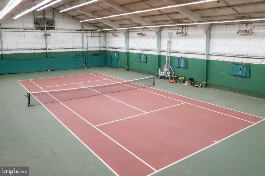 A Playground Paradise with an Indoor Tennis Court! One of the most unique properties you’ll ever see, with over 4 acres that include a main home, outdoor tennis court, swimming pool, a silo and highlighted by a massive indoor tennis building with a lounge, viewing area, kitchenette, locker rooms and all new LED lighting. This incredible structure has quite a history, including once being a practice site used by World Team Tennis players, as well as visited by many renowned stars. The indoor building is an incredible opportunity for tennis enthusiasts to have access to your own year-round tennis facility that could also be used for Pickleball, Padel, Basketball, Virtual Golf, Batting Cage, and many other unique uses. Looking for rainy day summer activities? Invite kids and adults over to play inside, the building has AC! This beautiful “campus” is extremely private and is situated at the end of a quiet street. Views from the living room and back deck of the Mid-century modern home are sensational! Whether you renovate the home or create your own design, the spectacular view is here to stay. This is a very rare opportunity to own an incredible “compound” that offers unlimited enjoyment, and with your added vision is an oasis unlike any other.