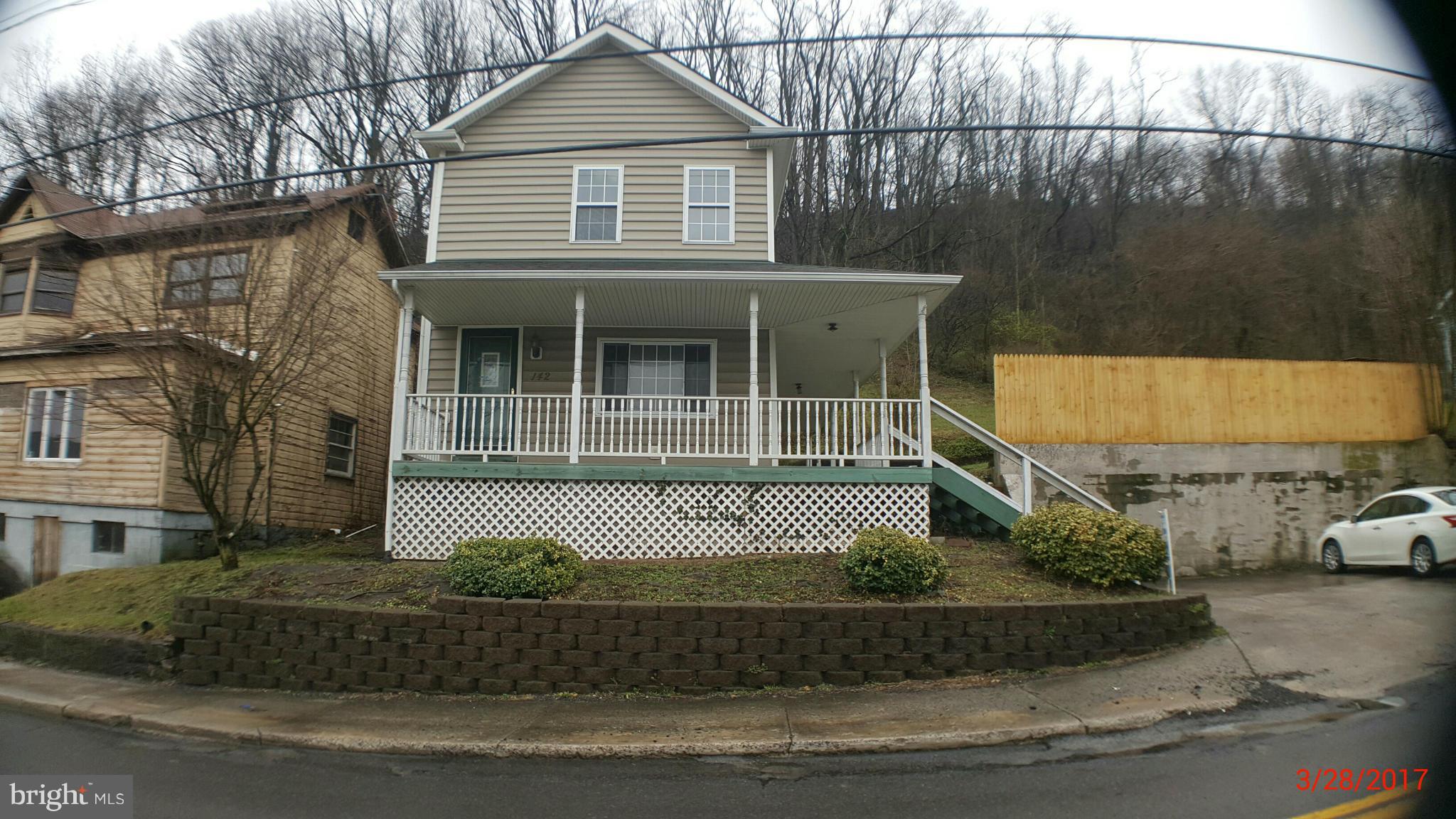Home features off street parking. Storage building. Large wrap around covered porch. 3 bedrooms, 1.5 baths. Unfinished basement for lots of storage.