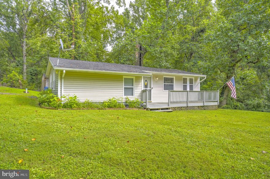 Welcome to 18301 Elm Trail, a charming 2-bedroom, 1-bath rambler located in the water-privileged community of Eagle Harbor. THIS LISTING INCLUDES THE SALE OF ONE ADDITIONAL LOT.  Nestled on a quiet corner lot and surrounded by trees, this home offers exceptional privacy and a peaceful setting. Enjoy water views, spend afternoons fishing just steps away, or relax by the fire pit and dine outdoors on the patio. This property includes an additional lot and no HOA, which offers space, freedom, and a lifestyle close to nature. Tax ID#17080834796 is included in the sale of the home (0.1720 acres).