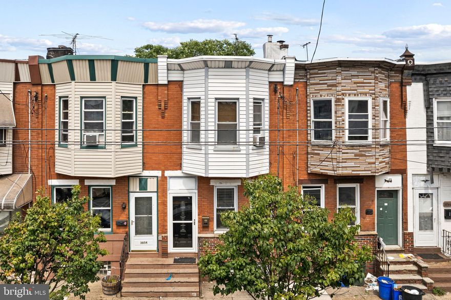 Welcome to 3056 Aramingo. This is an updated, light-filled home available for sale in one of Philadelphia's most vibrant neighborhoods! Ideally located in the heart of Port Richmond, this spacious 3-bedroom, 1-bath property offers comfort, convenience, and the charm of classic Philly row home living. Step inside and you're immediately greeted by natural light and an open-concept first-floor layout. The generous living and dining areas provide plenty of space to relax or entertain, with room for a variety of furniture setups. Just beyond, the large eat-in kitchen offers ample counter space, cabinet storage, and room for a table perfect for everyday living. From the kitchen, step out to your private back patio which is ideal for enjoying morning coffee or evening meals. Upstairs, you'll find three well-sized bedrooms, each with great natural light and closet space. A full hall bathroom completes the second floor. The home also features a clean basement for extra storage. This rental puts you steps away from some of Port Richmond's most popular local spots, including Gaul & Co. Malt House, Tacconelli's Pizza, La Roma, and Byrne's Tavern. With easy access to I-95, public transportation, parks, and shopping centers, commuting around the city is simple and convenient.