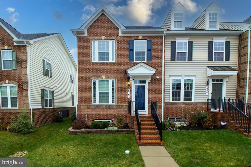 Ready to move in. Welcome to this sun filled, window-laden end townhome. Walk in the front door to your open concept main level, with a powder room, sitting room, a gourmet kitchen with a spacious granite island, sleek backsplash, formal dining area, and not to mention a comfortable living room to relax and unwind. The basement offers a large recreation area, bedroom + full bath. This home offers plenty of storage areas, in the basement, the attic space above the garage, and the guest room. Head to the second level of the home and into the primary bedroom - a dreamy, airy space, with a walk in closet and stunning bathroom with double vanities. The guest bedroom on the second level is custom from top to bottom, with a tailor-made wood accent wall and built in shelving around the closet. Guests/family will also enjoy having their own full bath. The laundry room is conveniently located on the second level, with upgraded custom tiling and cabinets. The fourth floor features the final bedroom, which can easily be used as a mother-in-law-suite, office space, an additional recreation room and another full bath. The options are endless! Walk out onto the stunning terrace which boasts comfort and privacy. This home is a commuters dream, just minutes away from I-270 and I-70. The community holds resort style amenities, such as a  clubhouse, an eight lane pool, leisure and tots pool, tennis courts, multiple playgrounds, basketball courts, large outdoor amphitheater, walking and nature trails.