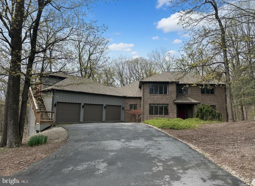 Located on a spacious wooded lot in one of the area’s most sought-after communities, Mountaindale.  Bring your vision inside, a few thoughtful updates could easily elevate this home to standout status. Mature trees surround the property, creating a peaceful backdrop for everyday living, outdoor entertaining, and relaxing by the heated in-ground pool w/new liner('24). Whether enjoying morning coffee on the deck or in the 4 season sunroom with lots of windows or unwinding in the screened porch, the beauty of the outdoors is always within view.

In addition to lots of wonderful windows, the home features generous room sizes and a flexible floor plan designed for both comfortable living and entertaining. The living room with wood fireplace and formal dining room with hardwood floors provide inviting gathering spaces. The kitchen offers a dining area, Pergo flooring, and convenient pantry access in the adjoining laundry room. A first-floor bedroom with full bath adds versatility for guests or multigenerational living, while the sunroom with vaulted ceiling, electric fireplace, and tile floor provides a bright, year-round retreat.  Open both sets of double doors onto the deck for great traffic flow when hosting gatherings.

Upstairs, the spacious primary suite includes a walk-in closet and private bath with spa tub. Two additional bedrooms and a full bath complete the second level.

The finished lower level significantly expands the home’s living space, featuring a family room with 2nd wood fireplace, a large great room, exercise room, and access to the screened porch.  Ideal for recreation, hobbies and more. 

An oversized 3-car garage includes a second-floor office with built-ins, vaulted ceiling, skylight, ceiling fans, and carpet—perfect for working from home or creative pursuits. Additional features include a security system, central vacuum, and wired sound system. Conveniently located near shopping, dining, I-81, and Route 322, with an easy commute to Harrisburg and the West Shore.