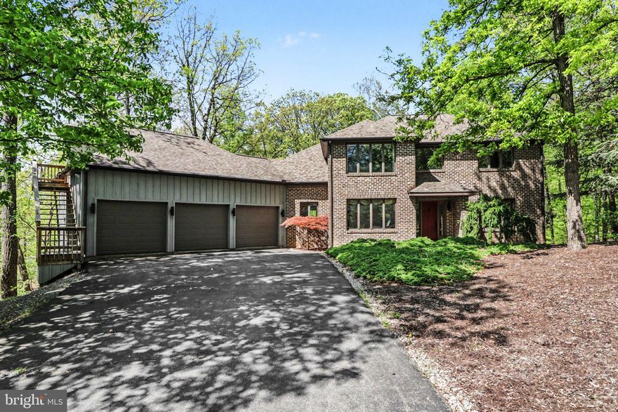 Located on a spacious wooded lot in one of the area’s most sought-after communities, Mountaindale.  Bring your vision inside, a few thoughtful updates could easily elevate this home to standout status. Mature trees surround the property, creating a peaceful backdrop for everyday living, outdoor entertaining, and relaxing by the heated in-ground pool w/new liner('24). Whether enjoying morning coffee on the deck or in the 4 season sunroom with lots of windows or unwinding in the screened porch, the beauty of the outdoors is always within view.

In addition to lots of wonderful windows, the home features generous room sizes and a flexible floor plan designed for both comfortable living and entertaining. The living room with wood fireplace and formal dining room with hardwood floors provide inviting gathering spaces. The kitchen offers a dining area, Pergo flooring, and convenient pantry access in the adjoining laundry room. A first-floor bedroom with full bath adds versatility for guests or multigenerational living, while the sunroom with vaulted ceiling, electric fireplace, and tile floor provides a bright, year-round retreat.  Open both sets of double doors onto the deck for great traffic flow when hosting gatherings.

Upstairs, the spacious primary suite includes a walk-in closet and private bath with spa tub. Two additional bedrooms and a full bath complete the second level.

The finished lower level significantly expands the home’s living space, featuring a family room with 2nd wood fireplace, a large great room, exercise room, and access to the screened porch.  Ideal for recreation, hobbies and more. 

An oversized 3-car garage includes a second-floor office with built-ins, vaulted ceiling, skylight, ceiling fans, and carpet—perfect for working from home or creative pursuits. Additional features include a security system, central vacuum, and wired sound system. Conveniently located near shopping, dining, I-81, and Route 322, with an easy commute to Harrisburg and the West Shore.