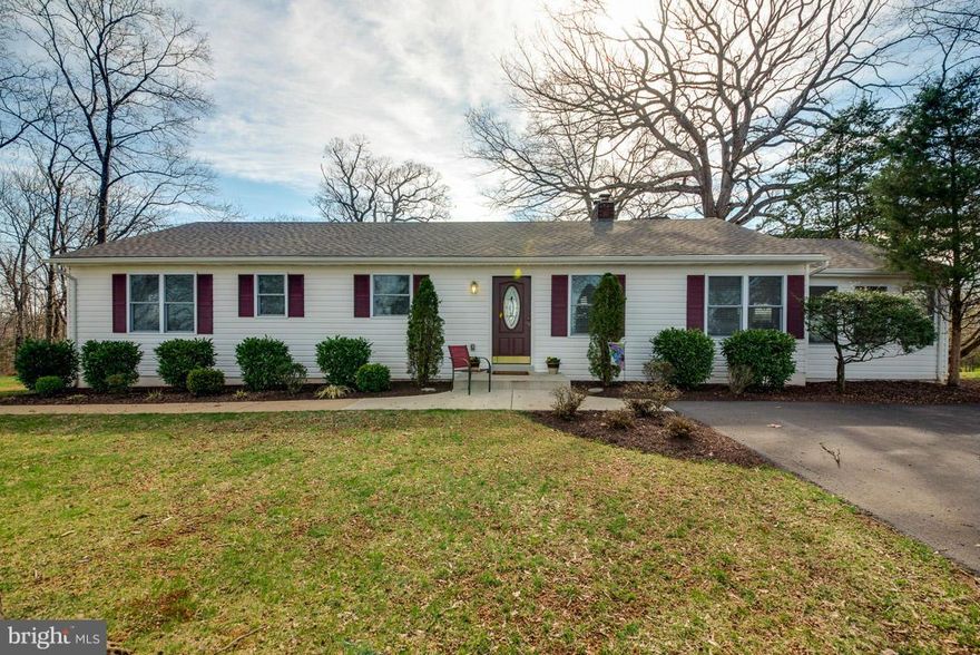 Remodeled rambler in immaculate condition on 2 private acres with detached garage.  Wood floors, Family room with wood burning fireplace, living room, sunroom, 3 bedrooms with 2 1/2 BA's.   Great location for commuters.  No HOA, no covenants, bring the animals.