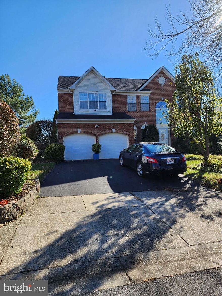 Welcome to 15103 Dunleigh Drive in Bowie, Maryland! Nestled on a quiet side street in the desirable  Devonshire Estates community, this exquisite 5 bedroom, 5 full bath colonial delivers 4,200 square feet of living space and a premium .24 acre lot.  A brick front exterior with tailored siding, 2-car front load, an open floor plan, warm hardwood floors, fireplace, and abundance of windows are some of the reasons this home is so special.  The grand foyer welcomes you home, as rich hardwood floors flow toward the living ,  family room, kitchen, office, and laundry area.  The gourmet kitchen is sure to please with gleaming granite countertops, 42" kitchen cabinets, plenty of lighting, gas cooktop, dual wall ovens, spacious pantry, and a center island.  The kitchen offers a breakfast room area with sliding glass doors leading to a deck.  This home has an office with a full bathroom on the main level.  The upper level includes a primary bedroom with an ensuite including separate shower, dual sinks, a jacuzzi tub, and spacious walk-in closet along with 4 spacious bedrooms and a full hall bathroom.  It's the perfect home in a fantastic location.  Welcome Home!