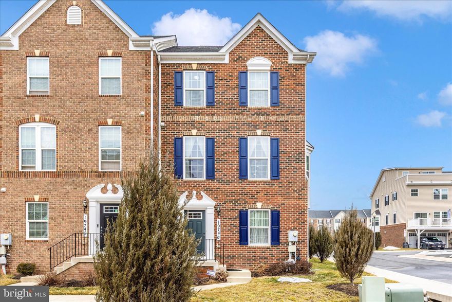 Sun-drenched luxury meets unbeatable convenience! This stunning brick-front end-unit townhome stands out with extra windows, flooding with natural light. The main level showcases gleaming hardwood floors and an expansive open-concept design where the spacious living and dining rooms flow effortlessly into the heart of the home. The gourmet kitchen is a chef’s dream, featuring granite countertops, stainless steel appliances, and a seamless transition to a large deck—perfect for outdoor dining and weekend relaxation.

The upper level offers three generous bedrooms, including a serene primary suite with a walk-in closet and the ultimate convenience of bedroom-level laundry. The versatile entry level features a fourth bedroom and full bath, providing the perfect footprint for a home office, guest suite, or recreation room, plus direct access to the attached 2-car garage which is EV ready.

Location is everything: Enjoy easy access to I-270 for a stress-free commute, while living just minutes from shopping, dining, and local entertainment. This rare end-unit gem offers a low-maintenance lifestyle without compromising on style or comfort. Schedule your tour today!