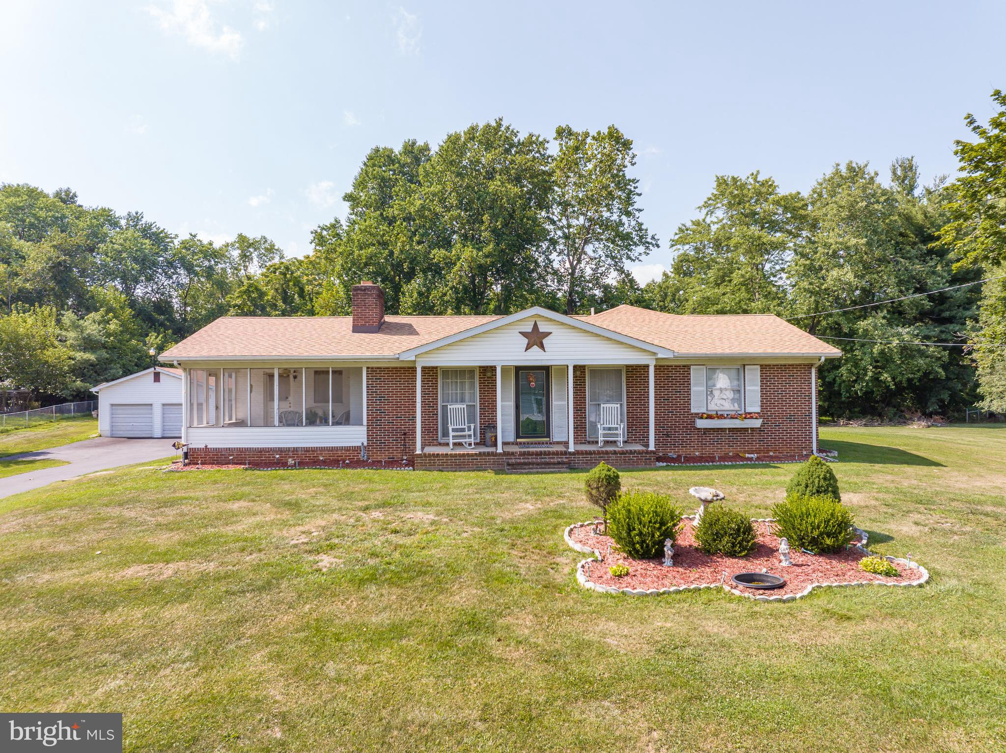 Don't miss viewing this home! Brick Rancher home with country kitchen, that leads to screen porch to enjoy, formal dining room and large living room, wood floors, fireplace, large primary bedroom with large primary bath with walk in closet and large linden closet and main level laundry room added. Still need more space there is the basement too with a finished room, (was used as bedroom) and 2nd laundry room and large room almost finished for 2nd family room. Lot of storage and walk up basement stairs. Oversized detatched garage with loaf storage, newer paved driveway for plenty of parking. Need more storage, 2 sheds and outside storage on rear of the home too. Newer architectural roof and heat pump. All on a level .96 acre lot and no HOA, unrestricted!! Great location!! Don't think this one will last long.....Come view!!!