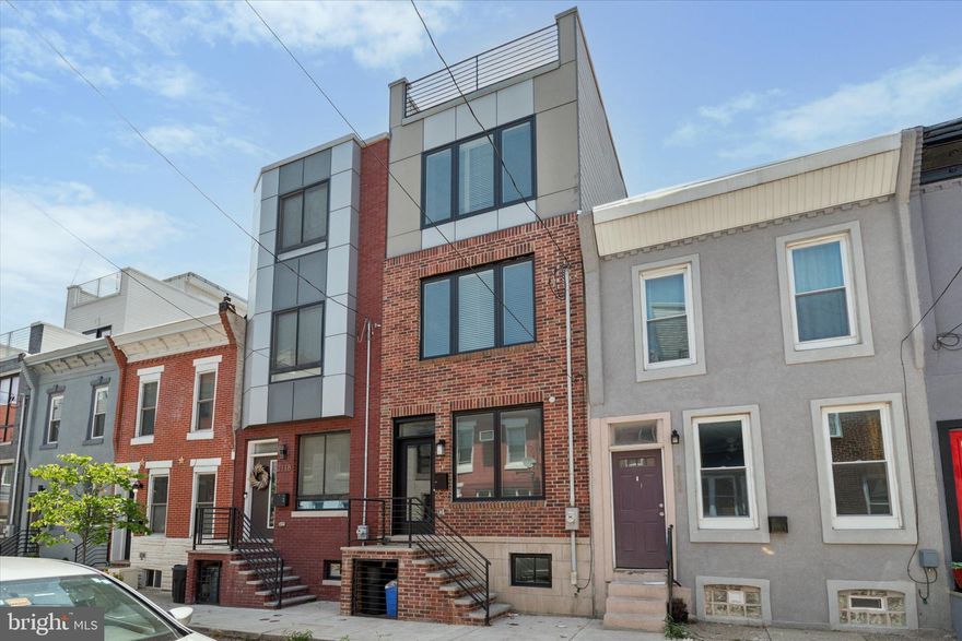 Welcome to this charming brick townhome nestled in the Point Breeze neighborhood of
South Philadelphia! This property boasts a spacious 3-bedroom, 3 full bath updated
design and an amazing roof deck with a city skyline view.

This neighborhood is a sought-after location. Close to shops, restaurants and a quick
jump to more spots in East Passyunk and Rittenhouse Square. It is conveniently located
near a Target, supermarkets, parks and public transportation.

The home is meticulously designed with well-appointed finishes throughout, including
beautiful hardwood floors. The main floor features an open-concept layout that connects
the living room, dining area and kitchen.

The kitchen is well equipped with stainless steel appliances, granite countertops, ample
cabinet space, and a stylish breakfast bar/island for food prep, casual dining and
socializing.

Upstairs you will find three generously sized bedrooms, each offering comfort and
privacy. The primary suite is located on its own floor with a walk-in closet and bathroom
featuring a large shower and soaking tub. The additional bedrooms can be made to suit
your lifestyle. They are perfect for children, guests, roommates or home offices.
An additional highlight of this home is its finished basement, which you can make into a
home theater, gym or additional entertaining space.

Outside you can enjoy a private patio in the back of the house and your very own
expansive rooftop deck with an incredible Philly skyline view. This type of outdoor space
is a real gem in the city!

The townhouse also features a 2-zone HVAC for efficient climate control throughout the
year.
