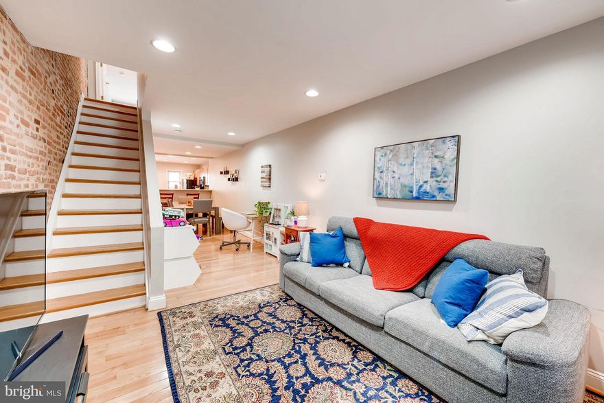 What a beautiful place to call home!This updated town house features 2 bedrooms and 2 baths, with wood floors throughout, off street parking and a deck with stunning views of the city! Park your car at your parking pad and take a walk at Patterson Park.  Enjoy gatherings at the open floor plan main level and rejoice in  the natural light that fills the space beautifully creating the feeling of your own retreat in the city! It is conveniently located near schools, restaurants, stores, Patterson park, Johns Hopkins Bayview, I 95 and I-895. Hurry, to make this home yours today!