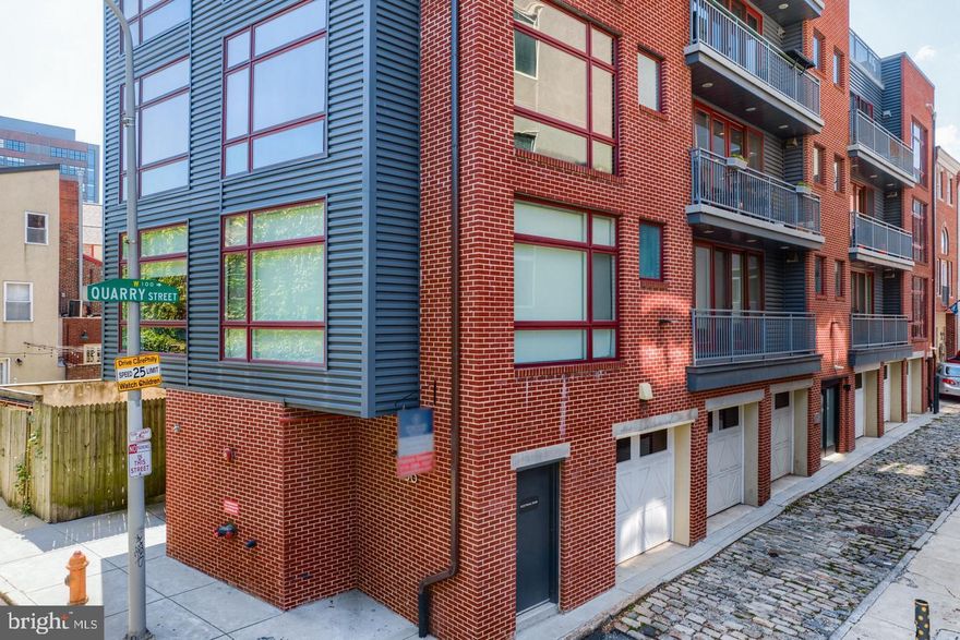 Welcome to 138-40 N Front Street #3F, a beautifully appointed 2 bedroom, 2 bathroom condominium located in the heart of Philadelphia’s highly sought-after Old City neighborhood. Situated in an elevator building, this exceptional residence combines modern design, smart technology, and breathtaking city views.
Upon entering the unit, you are immediately greeted by an expansive open floor plan that seamlessly connects the living and dining areas. Large format tile flooring and an abundance of natural light create a bright and inviting space. Floor to ceiling sliding glass doors lead to a private balcony, offering stunning, unobstructed views of the iconic Ben Franklin Bridge. The kitchen is thoughtfully designed with both style and functionality in mind, featuring quartz countertops, stainless steel appliances, sleek Porcelanosa cabinetry, and a center island complete with a built-in beverage refrigerator perfect for entertaining.
The spacious primary suite features large windows, a custom walk in closet with built in safe, and a luxurious en suite bathroom. The bathroom features a temperature controlled rain shower with body jets and a handheld spray for a truly relaxing experience. The second bedroom offers generous closet space and large windows treated with protective 3M film that filters harmful UV light. Throughout the home, each window is fitted with Hunter Douglas PowerView shades that can be scheduled and controlled remotely via your smartphone. Additional features include a full Smart Home system and ceiling speakers wired for music in every room, allowing for seamless entertainment and modern convenience. Ideally located just moments from I-95, public transportation, and the vibrant restaurants, cafes, bars, and shops that Old City is known for. This residence offers both luxury and convenience. Schedule your private showing today.