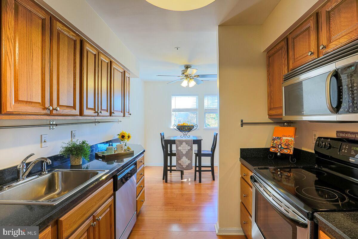 **THERE'S SOMETHING TO BE SAID ABOUT OWNING 1 OF THE NICEST CONDOS IN THE SUBDIVISION. THIS ONE IS THE TOP-FLOOR PENTHOUSE UNIT WITH CATHEDRAL CEILINGS. THE MASTER SUITE IS SPACIOUS, WITH IT'S OWN BATH AND WALK-IN CLOSETS. THE KITCHEN WAS REDONE AND HAS STAINLESS APPLIANCES WITH A SEPERATE DINING AREA AND SLIDERS TO THE BALCONY NEW WASHER AND DRYER. CEILING FANS. ASSIGNED PARKING WITH AMPLE GUEST SPACES.COMMUNITY POOL. CENTRALLY LOCATED BETWEEN COLUMBIA & ELLICOTT CITY WITH EZ ACCESS TO THE I 95 CORRIDOR