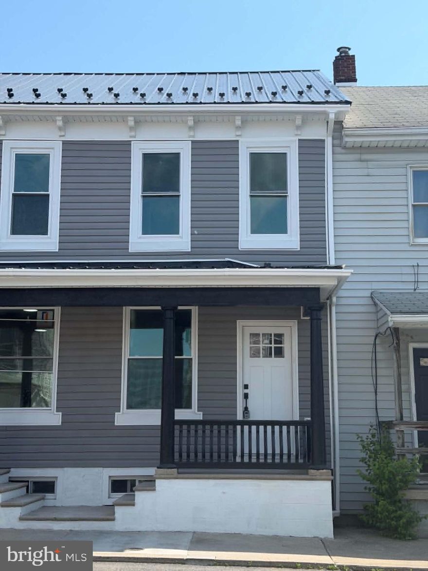 Literally almost every inch of this home has been remodeled! Two-bedroom, 1.5 bath row home with a finished attic for the third bedroom/office. Main floor has laundry room. Kitchen appliances negotiable with acceptable offer.  Flat rear yard with one car garage.