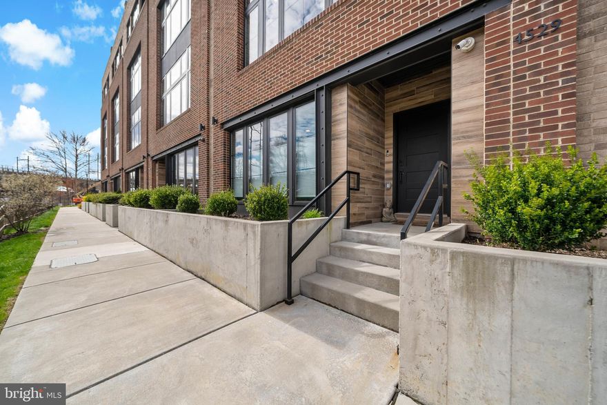 Experience unparalleled luxury living in the heart of Manayunk with scenic river views at The Locks at Venice Island! This exquisite townhome boasts high-end features and modern sophistication throughout its spacious 23 ft wide layout. Upon entry, you'll be greeted by a versatile ground floor space ideal for a bright study, den, or game room. The second level is designed for seamless entertaining, featuring a sleek kitchen equipped with Sub Zero refrigerator and Wolf range, a spacious island and a convenient pantry closet. Adjacent to the kitchen is additional cabinets, as well as a cozy breakfast or sitting area offering stunning river views. Completing this level is an open concept dining and living room, along with a convenient powder room. The third level houses an ensuite guest room, two additional bedrooms, a full bathroom with dual vanity, and a well-appointed laundry room. The primary suite is a true sanctuary, boasting motorized window treatments, custom closets, a private balcony, and an expansive walk-in closet. The luxurious primary bath features a walk-in marble shower and a large soaking tub. An additional room, perfect for a nursery, study, or home gym, completes this deluxe retreat. Enjoy the latest in smart home technology, two-car garage parking with an electric charger, and an elevator providing easy access from the ground level to the rooftop terrace, offering breathtaking panoramic views. Conveniently located with easy access to Center City, The Locks offers a short stroll to Main Street and downtown Manayunk, where you'll discover a myriad of shopping, dining, and entertainment options. Don’t miss the opportunity to make this truly stunning home yours!