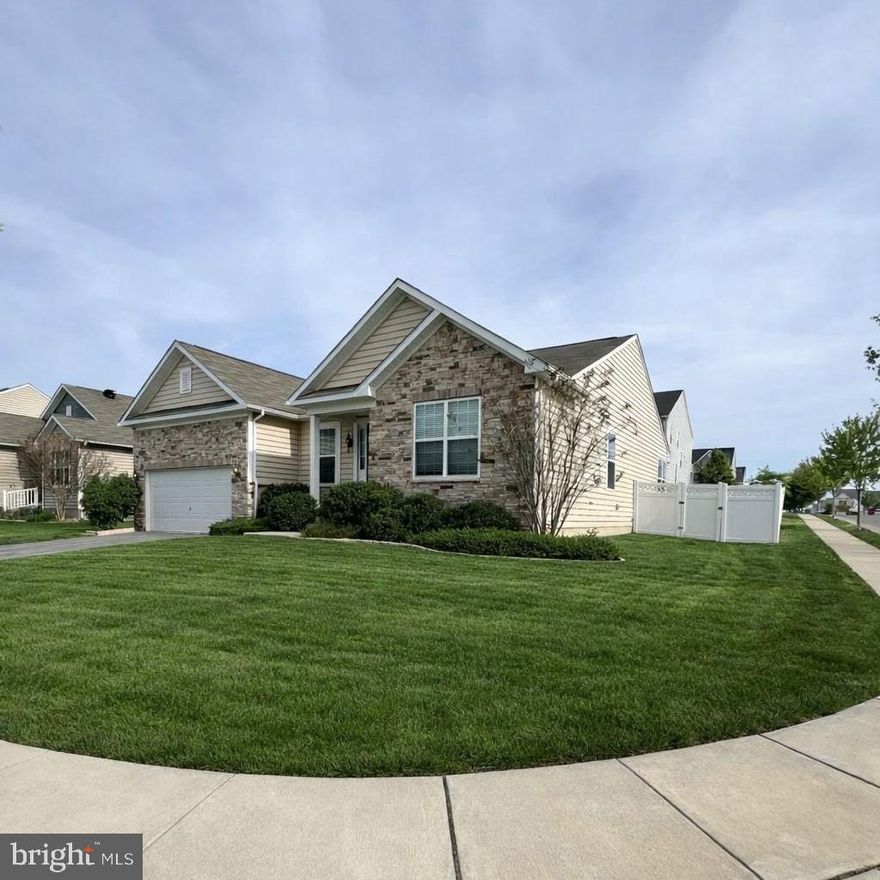 Located on a corner lot in Shenandoah Springs, this beautifully maintained 4-bedroom, 3-bath home built in 2018 combines the ease of main-level living with the added flexibility of a spacious walk-out basement. Set on 0.18 acres, the home features 9-foot ceilings, fresh paint throughout the main level, and a well-designed floor plan suited for both everyday living and entertaining. The main living areas are finished in luxury vinyl plank, with ceramic tile in the bathrooms and laundry room and carpet in the bedrooms. The living room is equipped with a Bose surround sound system, and the kitchen is impressively appointed with granite countertops, stainless steel appliances, soft-close cabinetry, dual wall ovens with convection, a pantry, French door refrigerator, coffee nook, and a large island with seating. Sliding glass doors from the dining area lead to a large concrete patio and fully fenced backyard with vinyl privacy fencing.

The main-level primary suite offers a walk-in shower, double vanity with granite countertops, large walk-in closet, and linen closet. Two additional bedrooms and a full bath on the main level provide added flexibility for guests, office space, or everyday living, along with a laundry room featuring front-loading washer and dryer. The walk-out basement extends the living space with a huge finished recreation room, a fourth bedroom with window egress and walk-in closet, a full bath with granite countertops, and a partially finished exercise room with durable epoxy flooring. The 2-car garage also features epoxy flooring. Additional highlights include a whole-house water filtration system, Nest thermostat, Ring camera, and security system with buyer activation required. Residents of Shenandoah Springs enjoy community amenities including common area maintenance, a pool, basketball and pickleball courts, and tot lots/playgrounds, all in a convenient location near shopping, restaurants, and commuter routes.