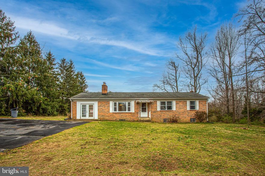 Terrific all brick home  4 BR 2.5 BA on an acre of land has plenty of room for everyone!  4 bedrooms on the main level, a full bath and a half bath and a large eat-in kitchen, living room, dining room and a masonry fireplace plus a deck on the rear.  There's hardwood flooring under carpet throughout most of main level, updated tile in the hall bath, and windows were replaced a few years ago.  There's a finished basement with wet bar area and 2nd masonry fireplace as well, also a full bath in basement. Big recreation room and 2 other rooms that could be den, study or exercise rooms. There are laundry rooms on both main level and basement level -- both with washers and dryers that convey.  Priced below market value -- This lovely home only needs a little TLC to really make it shine - it's ready for your special touches!  There is a lot of square footage for the $$ and on an acre of land in a convenient area.  The back yard is mostly level, and has a little sloped area as well. Also, there is a shed on the property. Home is being sold AS-IS. Don't miss this one -