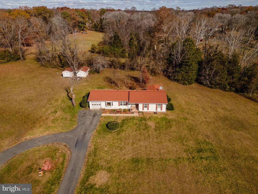 Exceptional property on nearly 4 acres with no HOA—hard to find and impossible to forget. This home offers a newly expanded paved parking area with room for up to 30 vehicles, making it perfect for RVs, boats, work trucks, or recreational toys. Enjoy your own private pond, ideal for fishing, relaxing, or simply taking in the peaceful views. Inside, the dining room opens through French doors to a patio made for gatherings, while the master bedroom features sliding glass doors leading to a spacious screened-in porch. Recently installed 40-year Owens Corning shingles on the home and both sheds add major value and durability. A rare combination of land, privacy, upgrades, and versatility, this property delivers what others can’t. Don’t miss this one.