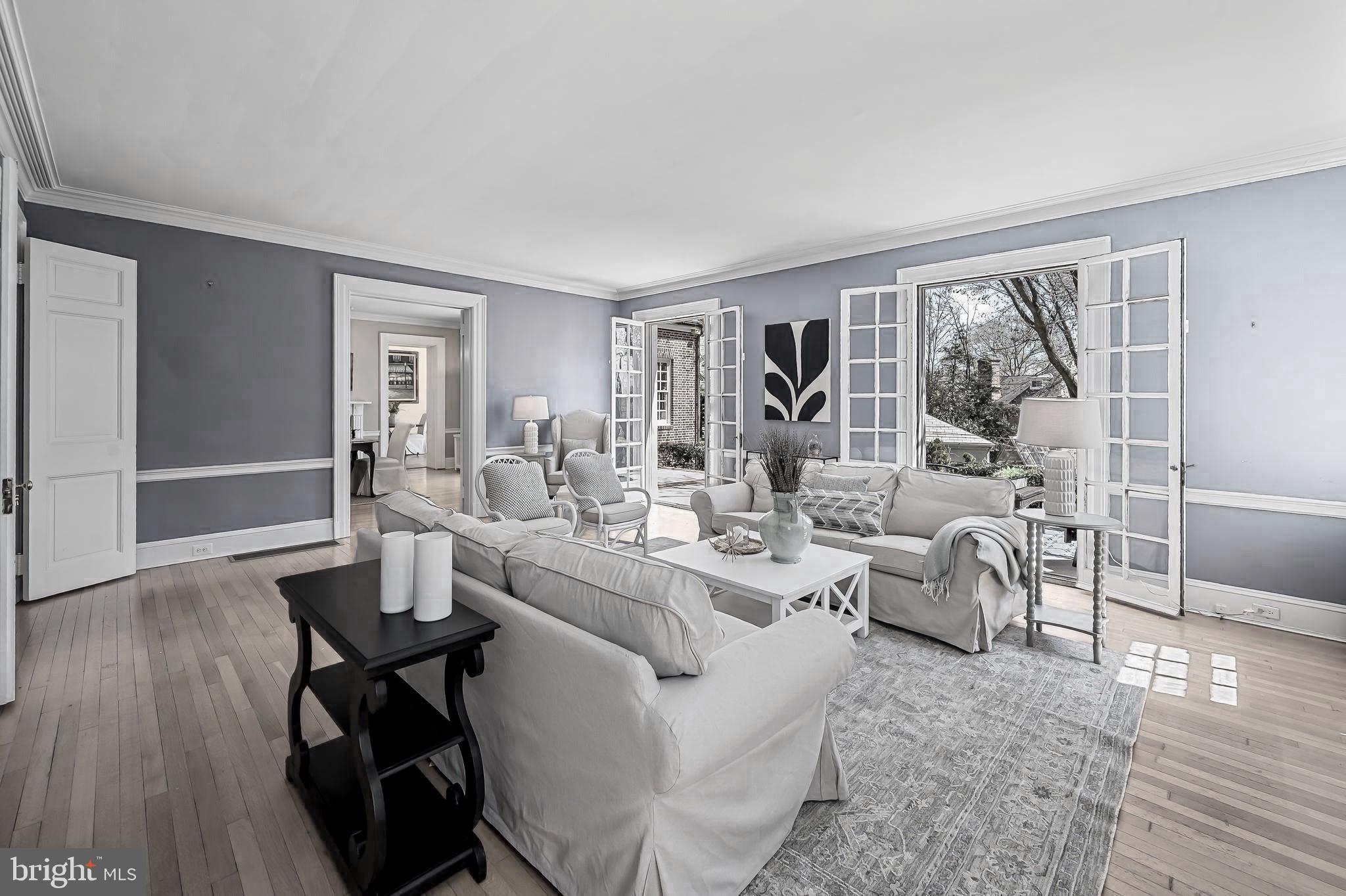 Motivated Seller has reduced the price to well below market value. A steal, at this price it will not last. Welcome to this exquisite all-brick Georgian masterpiece designed in 1925 by renowned Baltimore architect Laurence Hall Fowler. Ideally located just two blocks from Sherwood Gardens and close to Johns Hopkins University, Loyola, and several vibrant cafes and restaurants, this home offers a perfect blend of historic elegance and modern luxury. Classic architectural proportions meet grand scale: 12-foot ceilings grace the stunning Great Room, while 9-foot ceilings span the remainder of the home. With five generous bedrooms, three and a half baths, and six fireplaces (including an outdoor fireplace), this stately home is both spacious and welcoming. Since purchasing the home, the sellers replaced all roofing with new slate, repointed the all- brick exterior and renovated much of the interior. You’re greeted by a dramatic foyer with curved walls, built-ins, and an elegant sweeping staircase that sets the tone for what’s to come. A convenient powder room and coat closet are also tucked just off the entry. The expansive living room features floor-to-ceiling windows and French doors that open to a peaceful, closed-in backyard oasis. Additional French doors lead to a formal dining room, and a third set opens into the showstopping Great Room (16.3 ft. x 28 ft.), ideal for entertaining or relaxing in style. The updated Chef’s kitchen seamlessly integrates modern convenience with timeless style—Subzero and Viking appliances, three sinks with disposals, three high-end dishwashers, an updated pantry, and more. Recent updates throughout the home—like gleaming hardwood floors, a reimagined third floor, and a spacious, finished lower-level fitness room (13 ft. x24.2 ft.)—preserve its original character while elevating everyday living. Modern amenities include: multi-zone central air (including Space-Pak for upper floors), basement waterproofing with French drain system and two sump pumps, 75-gallon water heater, and an integrated indoor/outdoor SONOS sound system with individual zone controls. The garden transforms beautifully with each season, offering serene privacy—truly a retreat from the outside world. This is your chance to own a piece of Baltimore’s architectural legacy with all the comforts of today. Schedule your private tour and experience this remarkable home for yourself!