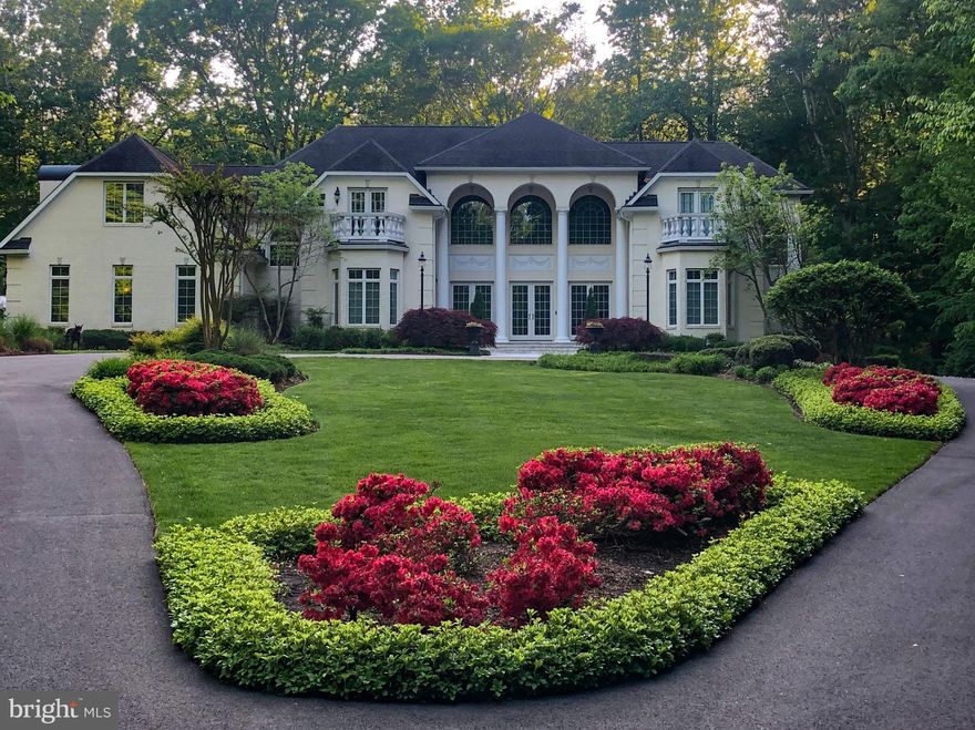 This RENOVATED, MOVE-IN READY Scholz Design Estate, in the prestigious SOUTH RIVER COLONY ESTATES WEST community in Edgewater, Maryland, is a MUST SEE.  Situated on 2+ acres in a private cul-de-sac, between the 6th and 7th holes of the Golf Club at South River, this home features over 9,500 sf of living space, 5-6 bedrooms, 5 full baths, 3 half baths, office, bonus room, 3 natural gas fireplaces, 2 laundries, a finished walk-out basement, screened porch, fitness center, sauna, MAGNIFICANT “OLD WORLD” WINE CELLAR, a 3 car side-load garage and SO MUCH MORE…

As you drive up the picturesque driveway, you will be impressed by the professional landscaping and exterior features of this beautiful property.  Sparkling white/silver travertine tile walkway leads to the front doors. As you enter the main level, the exquisite FORMAL LIVING ROOM greets you showcasing its two-story ceilings, custom moldings, floor-to-ceiling wall of windows and Italian plastered/white marble surround fireplace, custom made by Italian artisan, Robert Gianetti. 

The PRIMARY BEDROOM SUITE is located on the main level and features tray ceilings, accent lighting, walk-in closets, separate sitting room with cozy gas fireplace, convenient laundry room and a stunning primary bathroom. The primary bathroom was renovated in 2024 and features custom porcelain tile, new light fixtures/chandeliers, under cabinet LED lighting, two craftsman style vanities, free standing soaking tub, extra-large mirrors, Italian glass shower with 2 heads, wall jets, hand-held side spray and a bidet toilet with warming seat. 

The UPDATED KITCHEN is a must-see and perfect for entertaining. Highlights include custom cabinetry, Blanco Quartzite counter tops, 48” natural gas Viking Range with 6 burners, griddle, double ovens, Viking 26” warming drawer, Subzero 600 Series Refrigerator/ Freezer with maple cabinet front facades, Bosch SS dishwasher, GE SS microwave, 2 new garbage disposals serving each of the two island sinks, new Eskay 30” rectangular workstation SS sink and new recessed lights/chandelier.  

Off the kitchen is the FAMILY ROOM with 11’ tray ceiling and stone gas fireplace that opens to a FLAGSTONE DECK overlooking the backyard. A BONUS ROOM, FORMAL DINING ROOM, TWO HALF BATHS and MUDROOM complete the main level.  10’ ceilings on the main level and basement, 9’ ceilings on the second level.  FOUR BEDROOMS, OFFICE with washer/dryer closet and 3 BATHS are on the second level.

The FINISHED WALK-OUT BASEMENT features custom lighting, L-shaped Bar, granite countertops, dishwasher, microwave, refrigerator/ice maker, wine cabinet and copper sink. A GAME ROOM with travertine floors opens to the large SCREENED PORCH overlooking the backyard and FLAGSTONE PATIO. The focal point of the basement is the 1200+ bottle, climate controlled “Old World” WINE CELLAR with iron doors and custom mahogany woodwork. The RECREATION ROOM features a Savant Audio/Video System for multi-television viewing.  Five wall mounted televisions convey. The glass enclosed FITNESS CENTER features machines/cardio equipment and a SaunaTech CEDAR SAUNA. A FULL BATH with SteamMist shower and 6th BEDROOM is conveniently located across from the full bath.  
The heated, extra-large, SIDE-LOAD 3 CAR GARAGE includes epoxy flooring, cabinets/workbench, storage racks, new garage door openers, Wi-Fi video/audio security cameras and new central vac system. Whole house 45KW natural gas GENERAC GENERATOR and newer 5-zone high efficiency Carrier and Trane HVACs. Two newer hot water heaters (one is tankless) ensure there is always hot water. Other features include two acres of invisible fencing, basketball court, outdoor Bullfrog hot tub, pergola/picnic table, smokeless firepit and illuminated baseball batting/sports cage on the lower lot.  

Community amenities include 2 swimming pools, tennis/pickleball courts, tot lot, picnic areas.  Golf course memberships available.  BLUE RIBBON SOUTH RIVER SCHOOLS