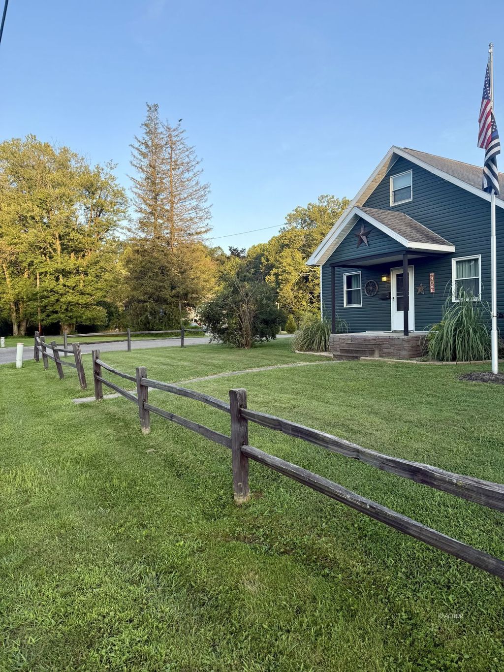 Photo of 93 E Main St, Glouster, OH 45732 (MLS # 2434043)